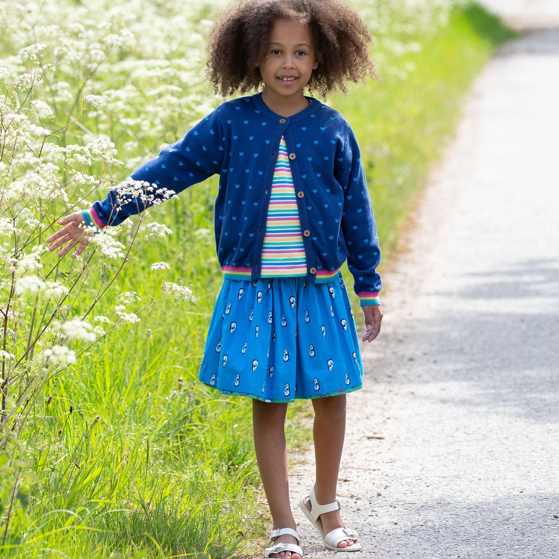 Girl wearing Kite Clothing Park Life Reversible Skirt blue