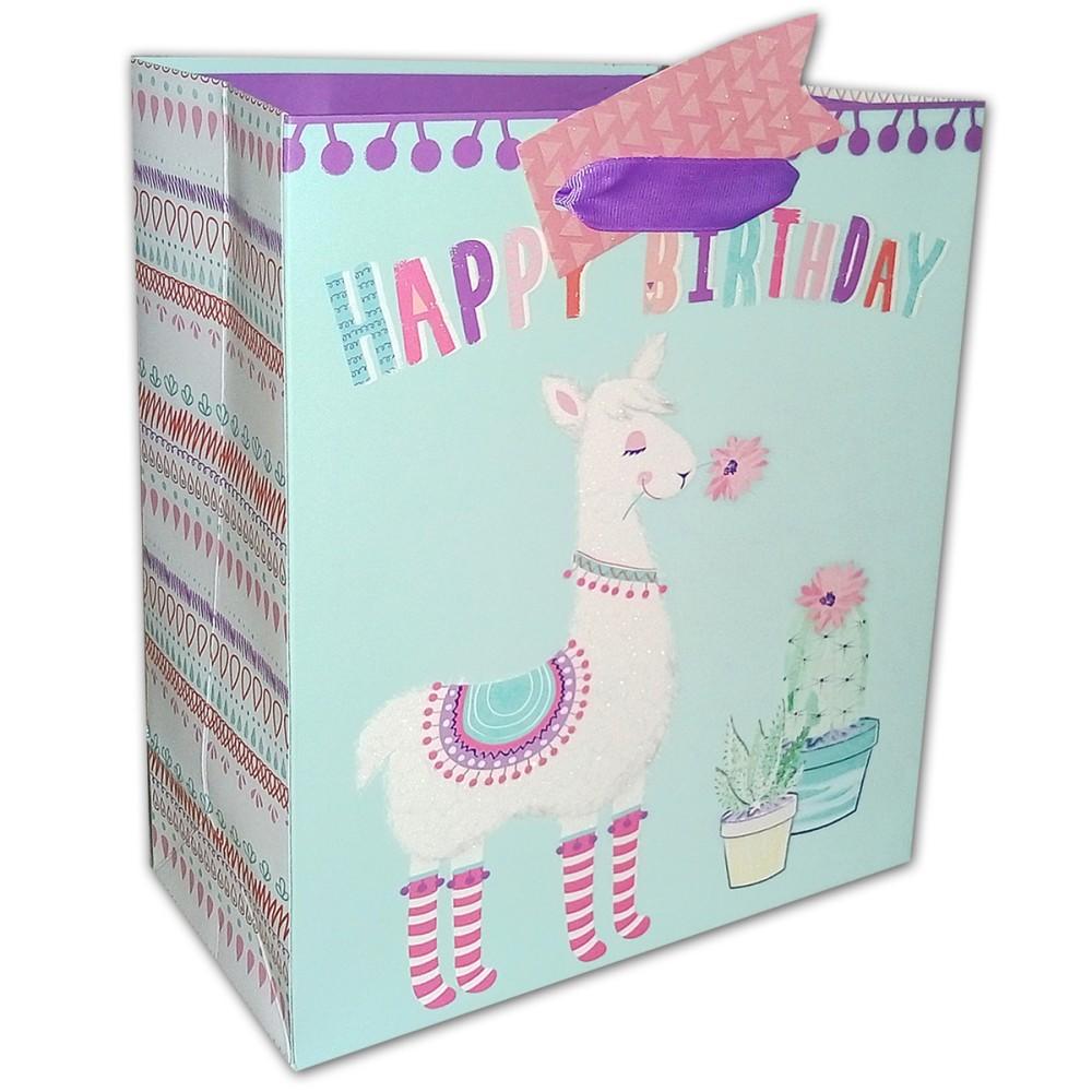 Happy birthday `Llama` gift bag with ribbon handles and message tag.