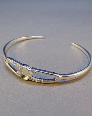 Silver Bangle Bracelet with a CZ Halo and space for a colour stone of choice.
