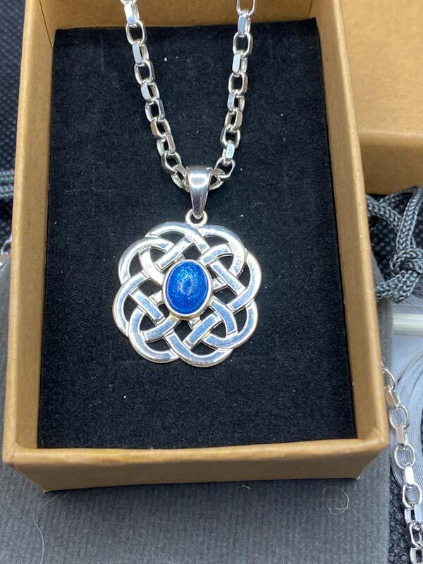 Matching Set with the Blue Stud Earrings. Silver Celtic Style Circle with an Oval Stone Containing Ashes.