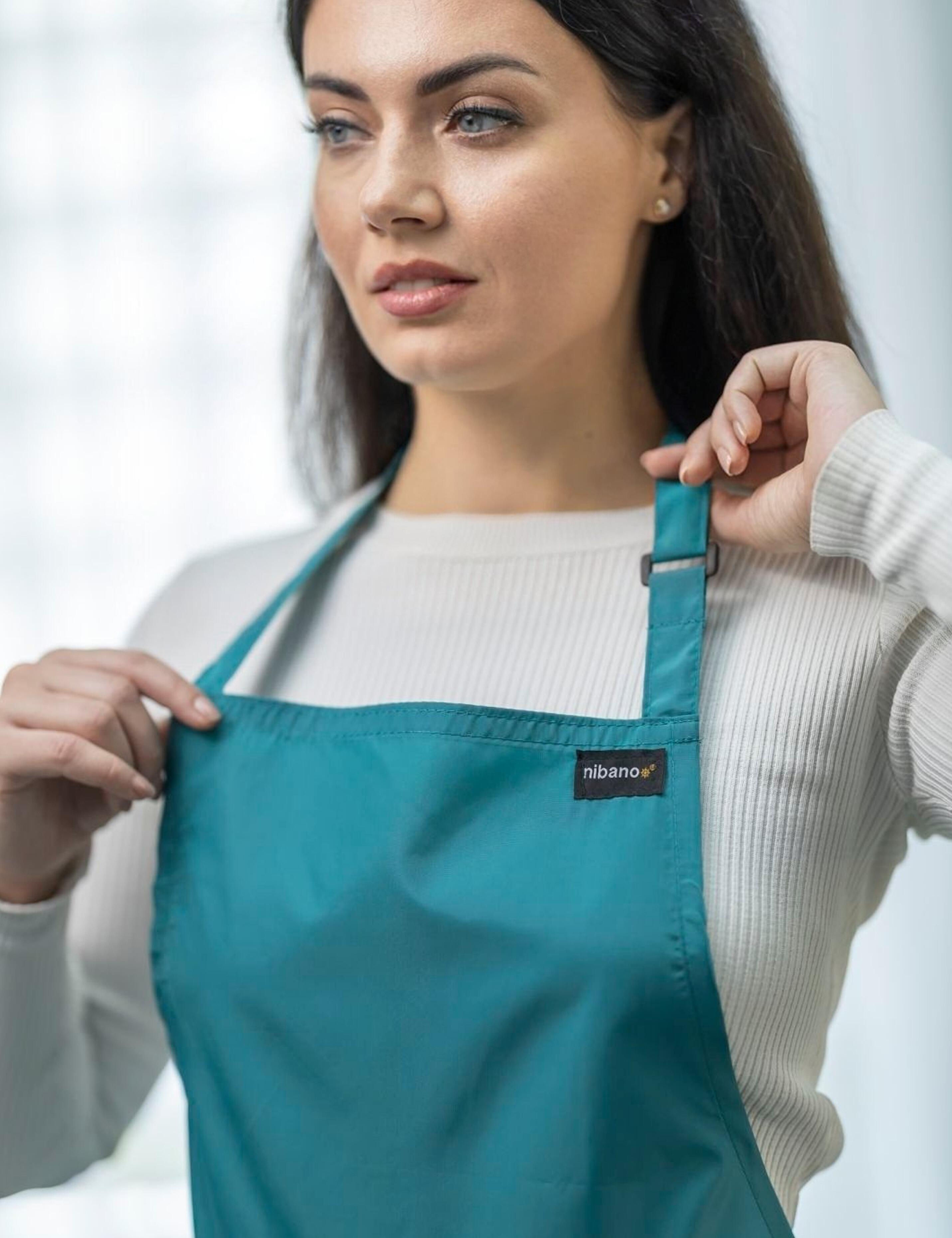 Waterproof teal barber apron for cutting and styling