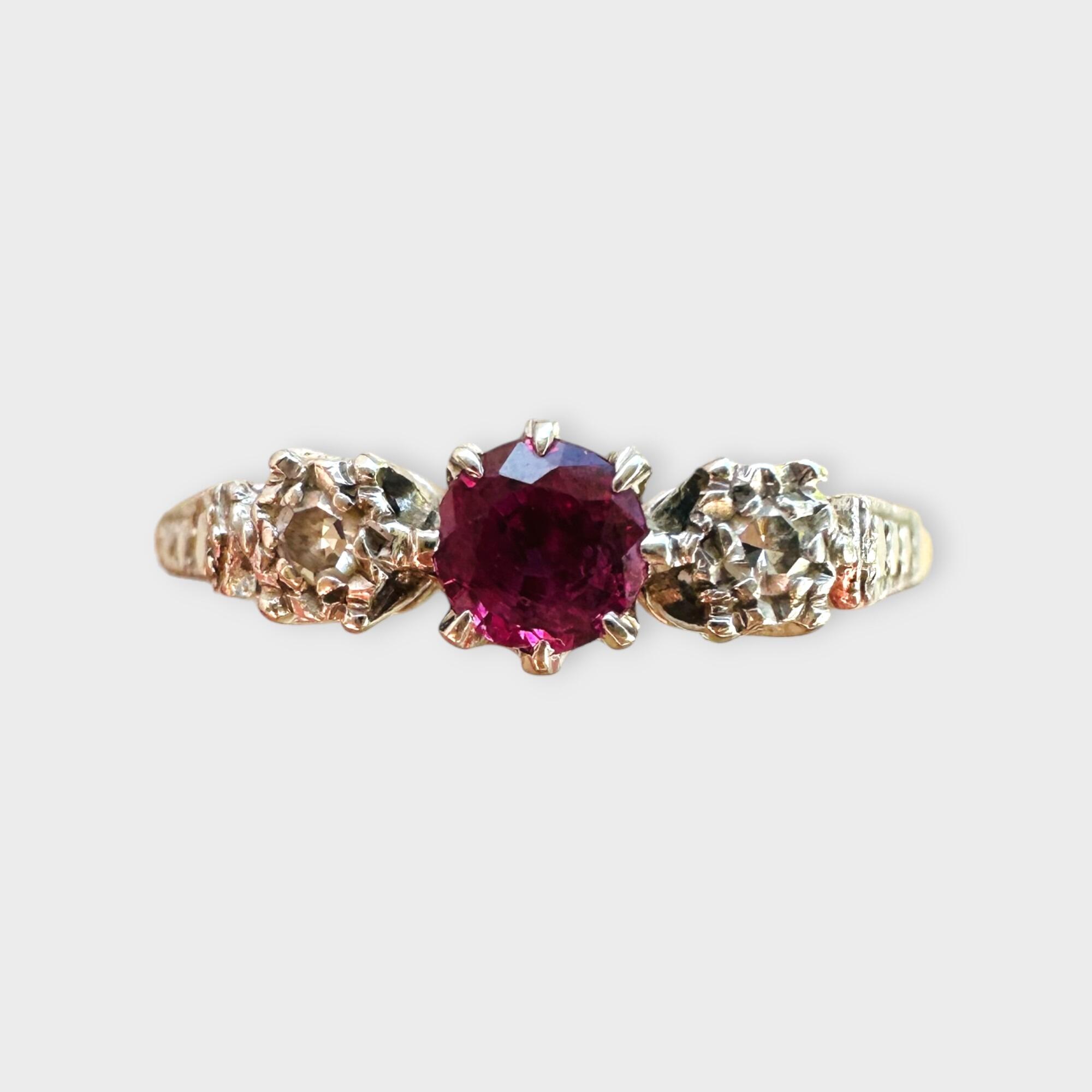 Art Deco Ruby and Diamond Trilogy Ring, grey background.