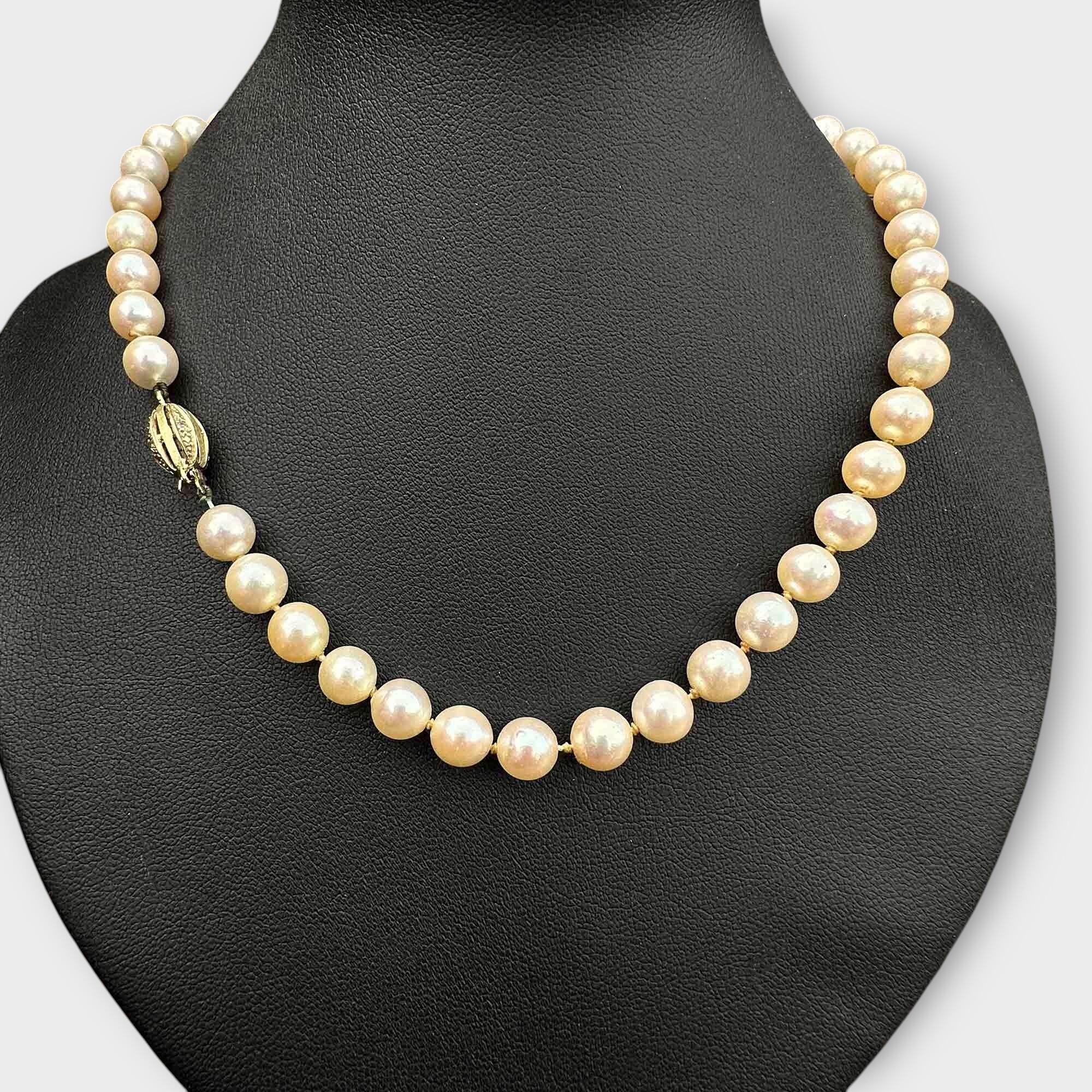 Vintage Cultured Saltwater Pearl Necklace and 14k Gold Diamond Clasp, displayed on a black bust.