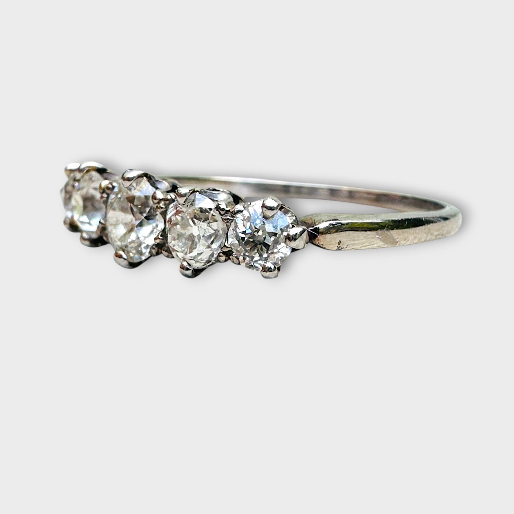 Edwardian five-stone diamond ring in 18K white gold with old European cut diamonds, featuring a 4.5mm center stone flanked by two 3.5mm and two 3mm diamonds, circa 1900s