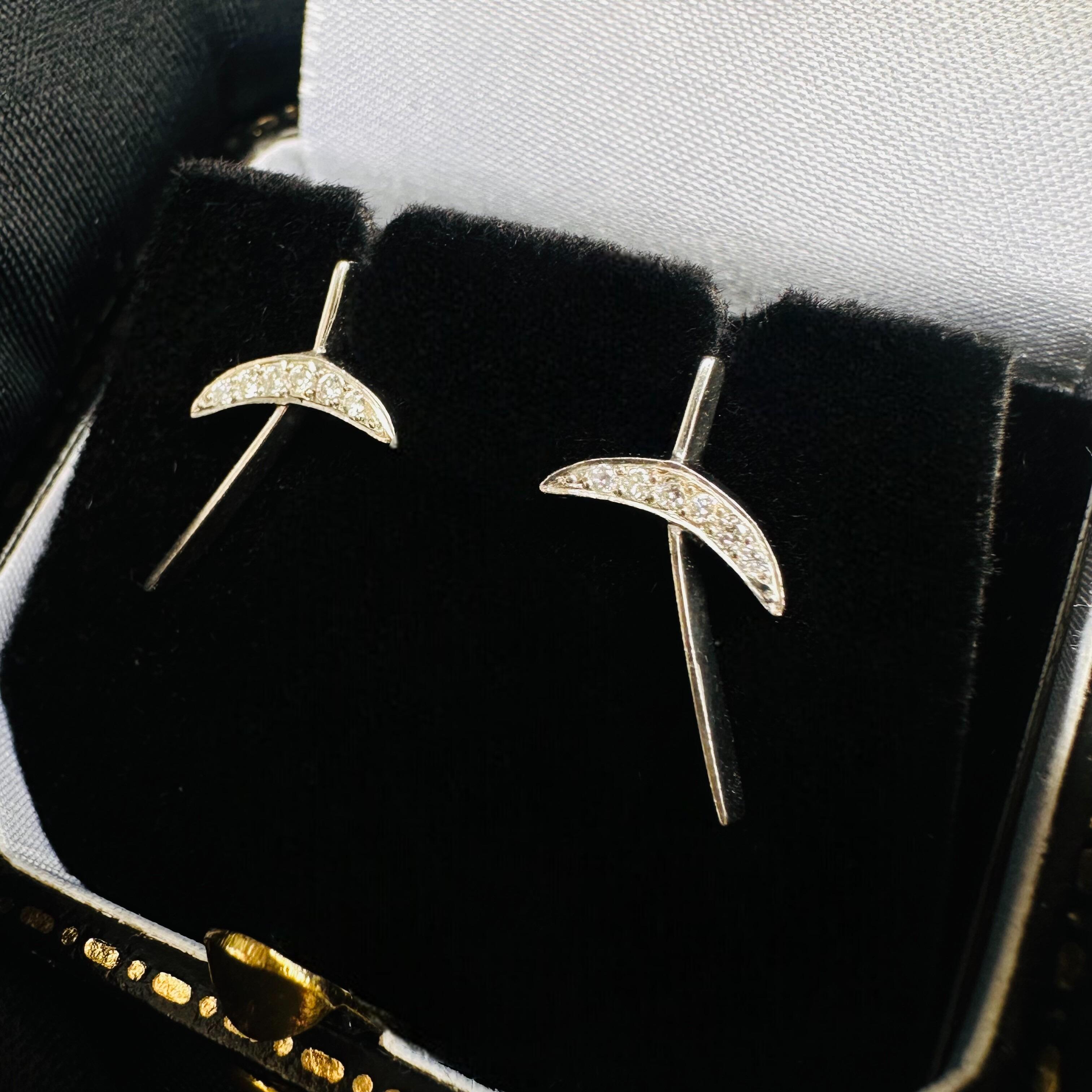 Platinum & Diamond Kiss Earrings displayed in black velvet antique box
