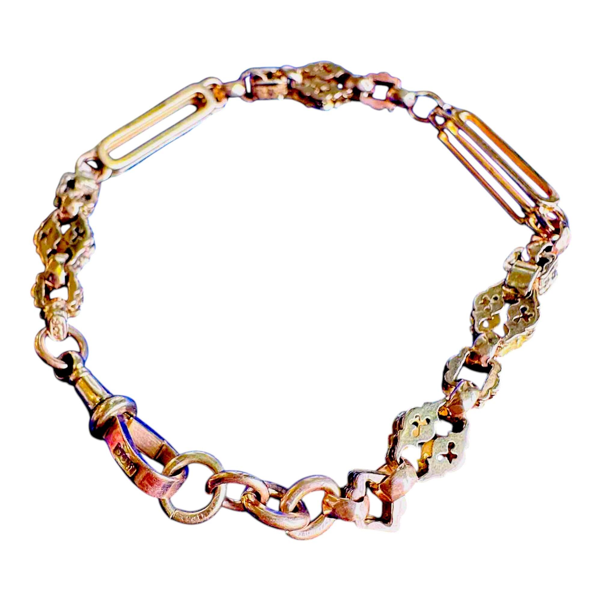 Side view of Victorian 9ct gold bracelet showing link texture and craftsmanship with white background