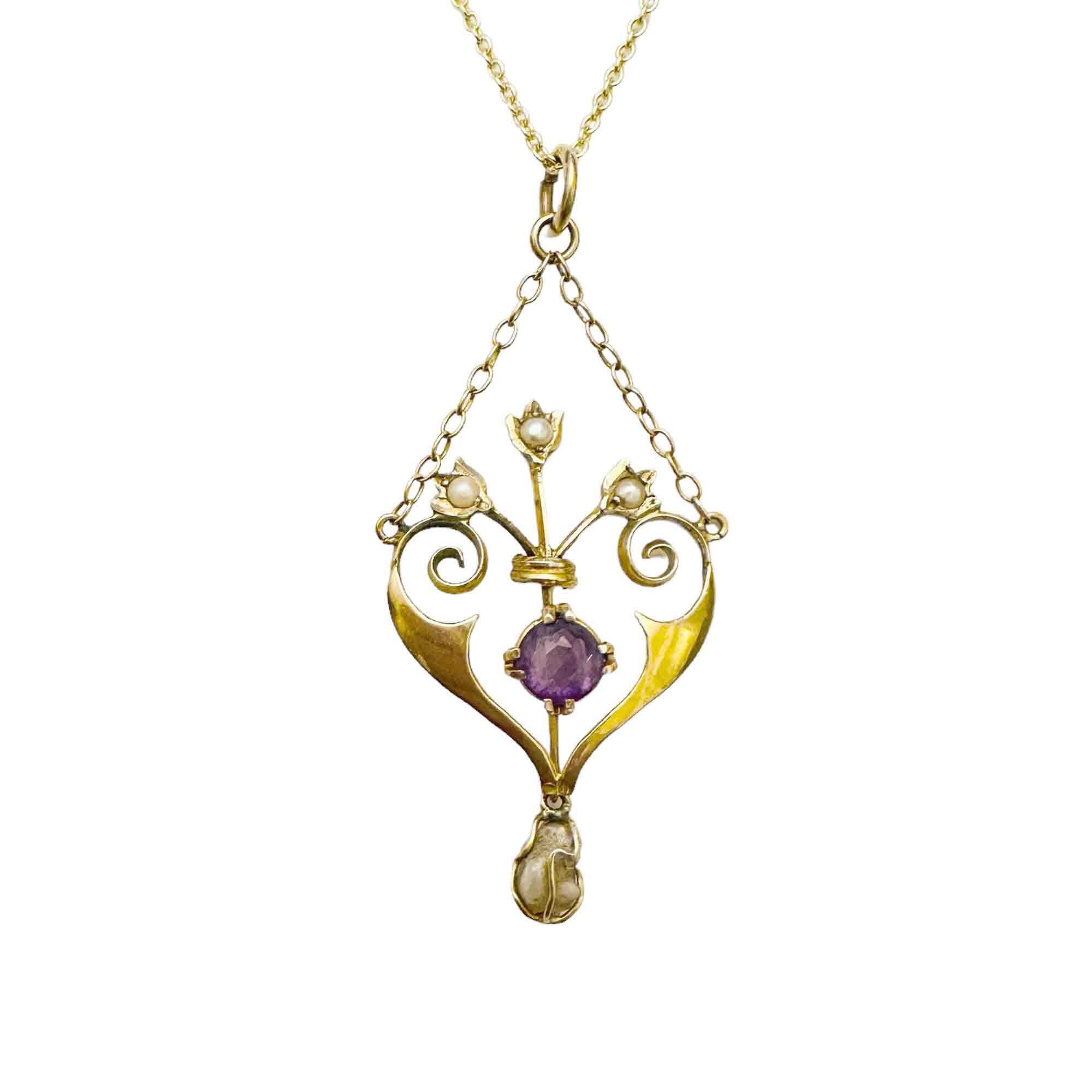 Art Nouveau necklace with openwork heart pendant, amethyst and pearls with white background