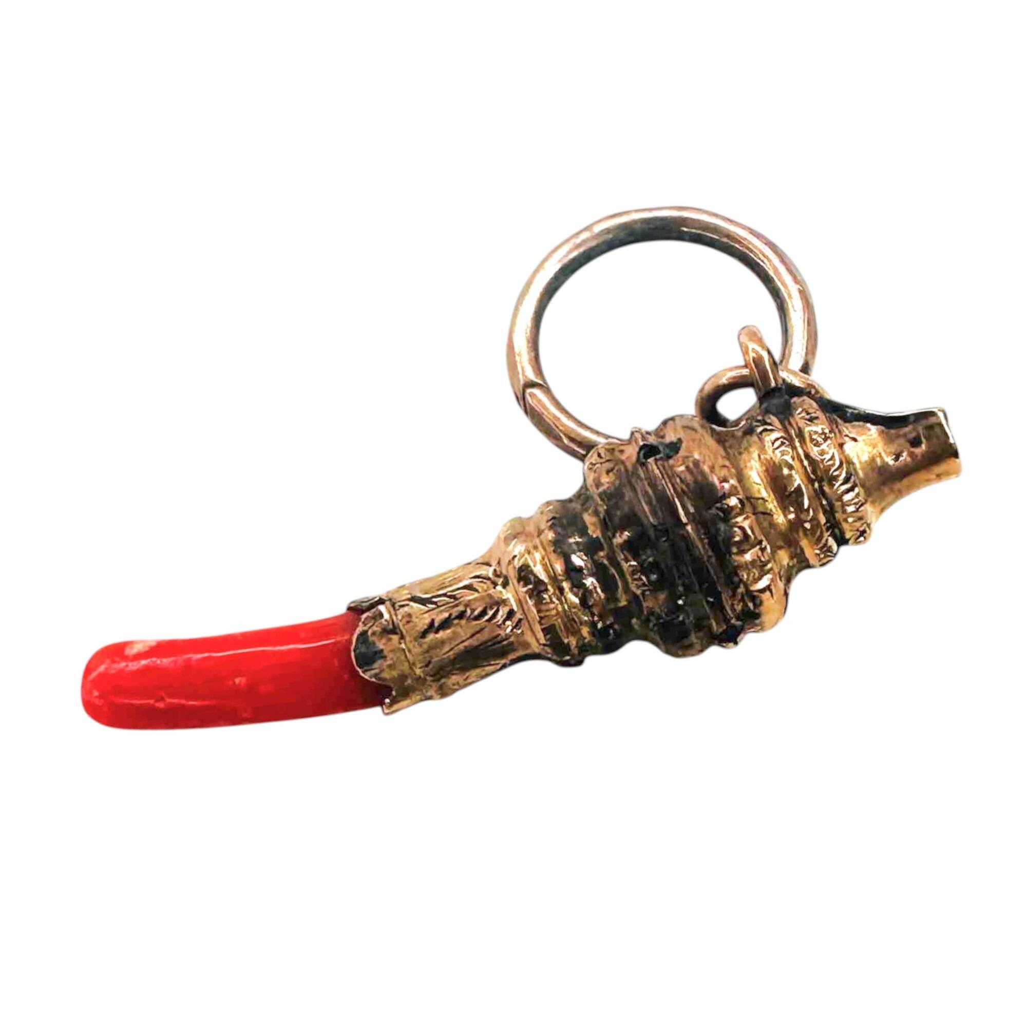 Antique Georgian 9ct yellow gold and coral baby's whistle and teether charm or pendant with split ring on white background