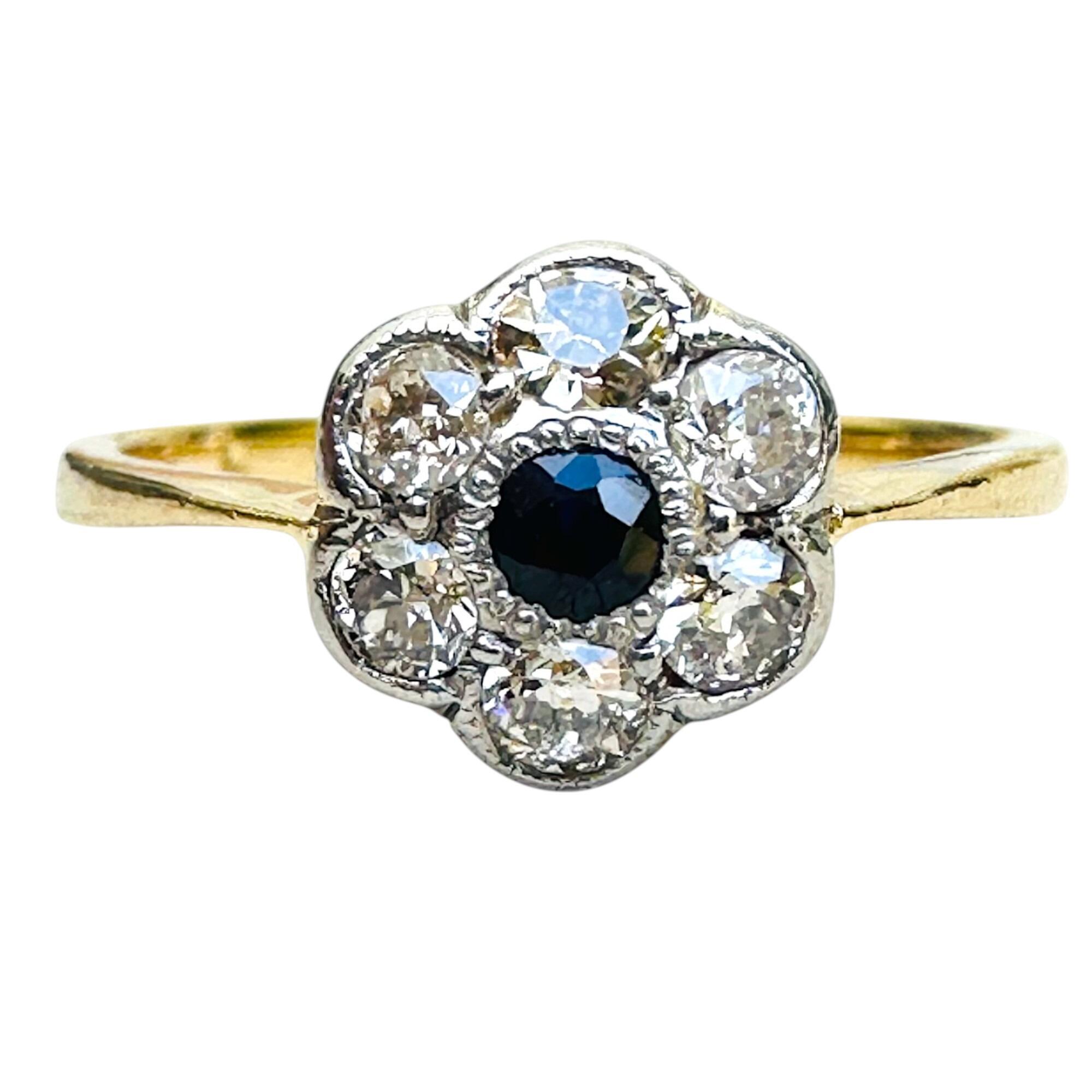 Art Deco 18k gold Sapphire and diamond cluster daisy ring on white background