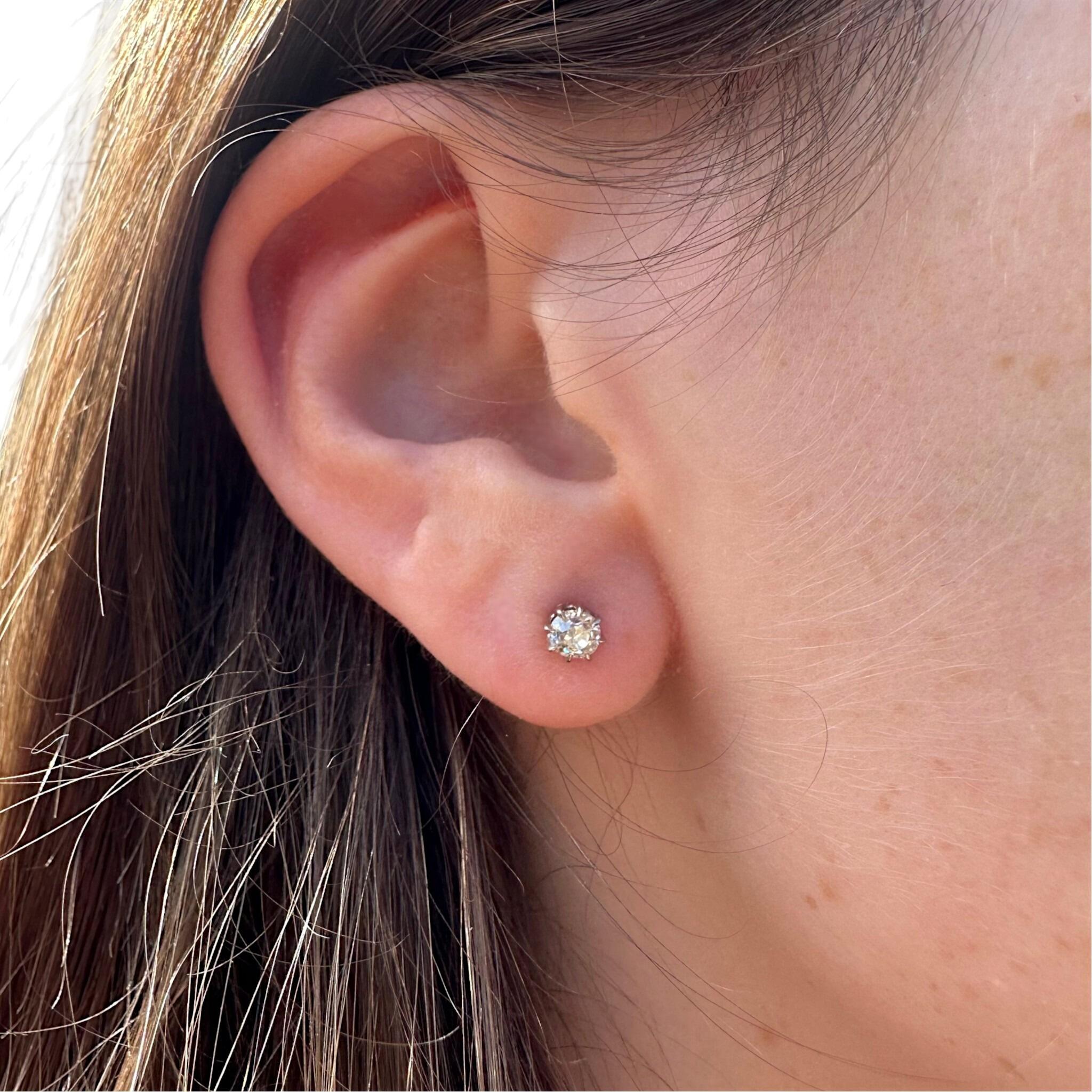 Antique 18k Gold Old European Cut Diamond Stud Earrings displayed on models ear
