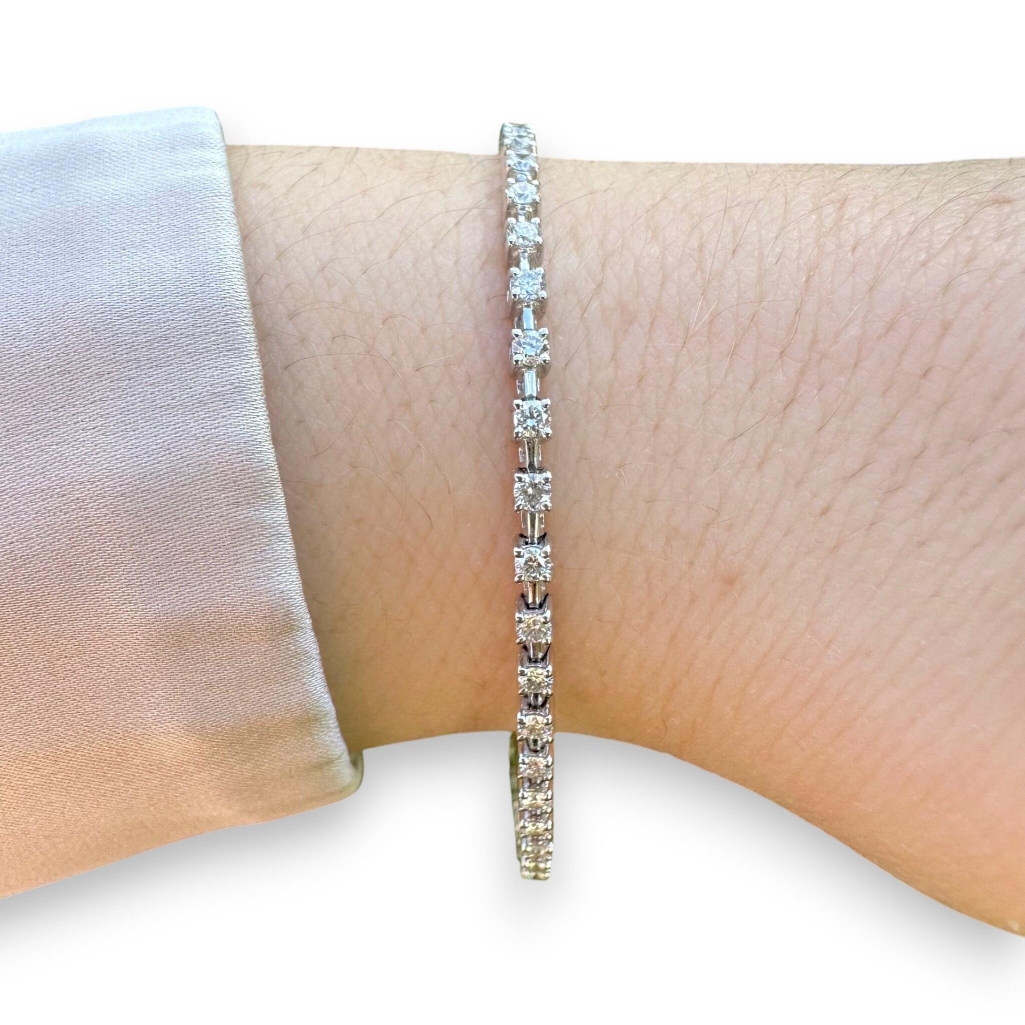 18K White Gold Diamond Tennis Bracelet displayed on models wrist on white background