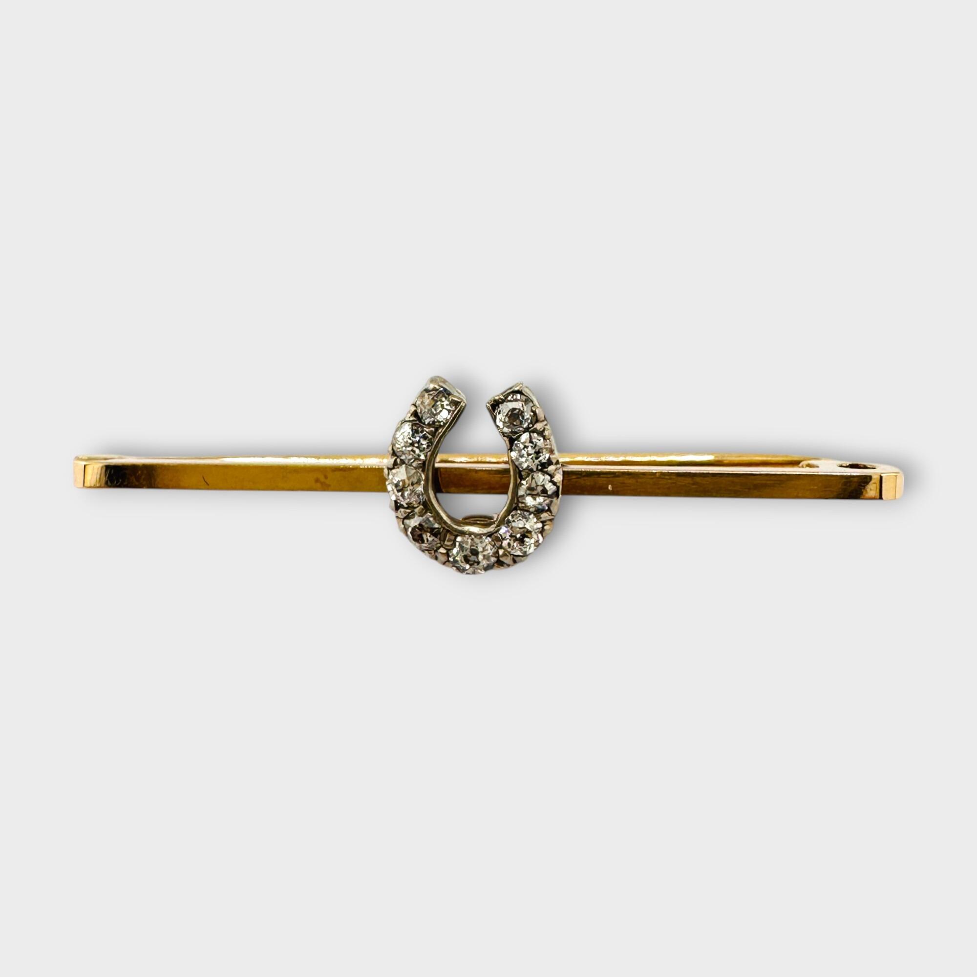 Edwardian 9ct Gold old cut Diamond horseshoe bar with grey background