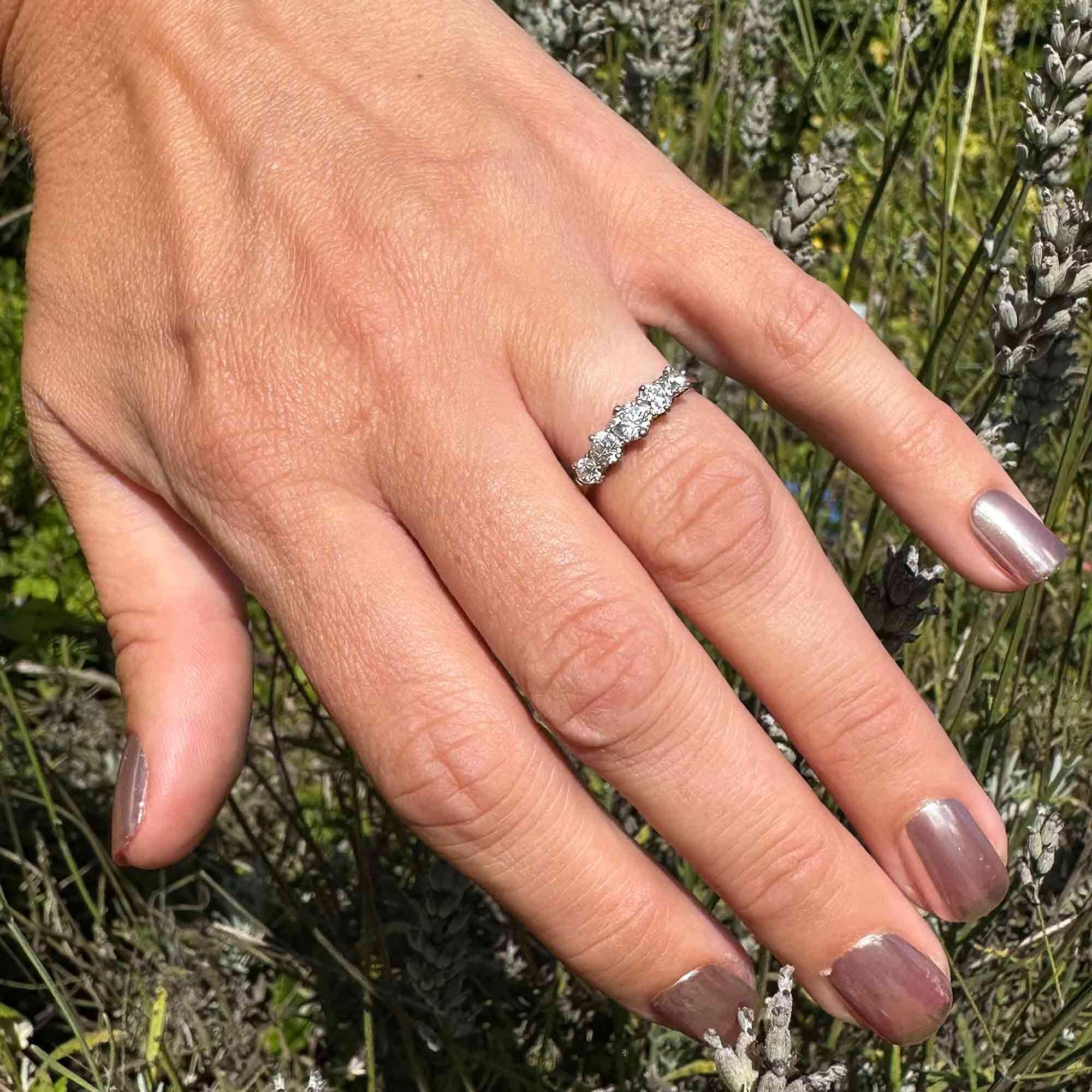 Antique Edwardian diamond ring in romantic vintage setting, featuring glowing old European cut diamonds in white gold