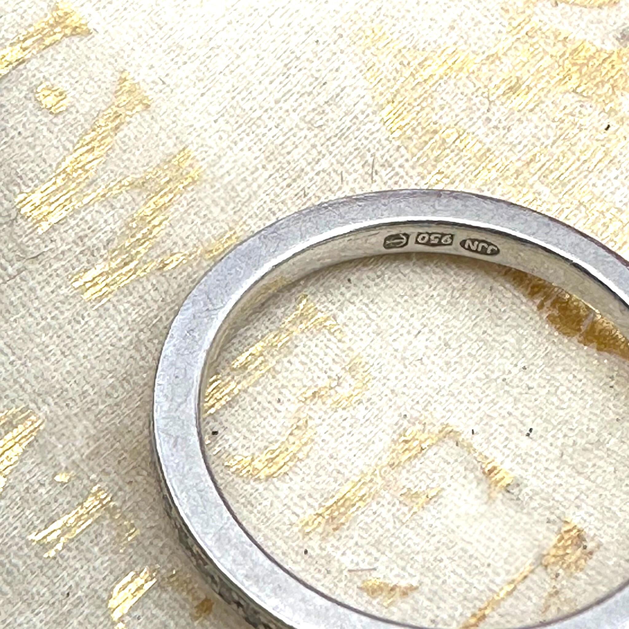 top view of Vintage Platinum Diamond Eternity Ring, Wedding Band  displayed on antique box