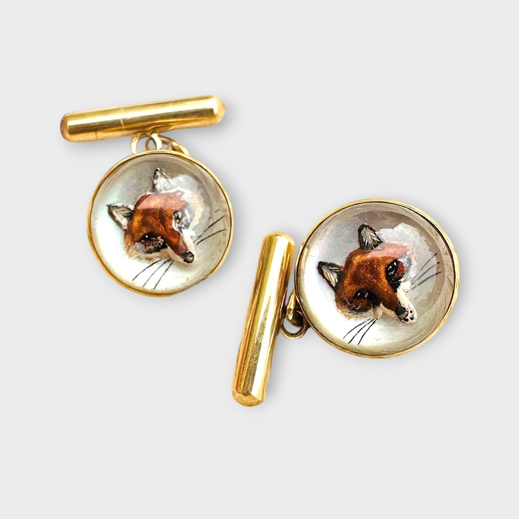Edwardian 18k Gold Intaglio, Essex crystal fox head cufflinks on grey background.