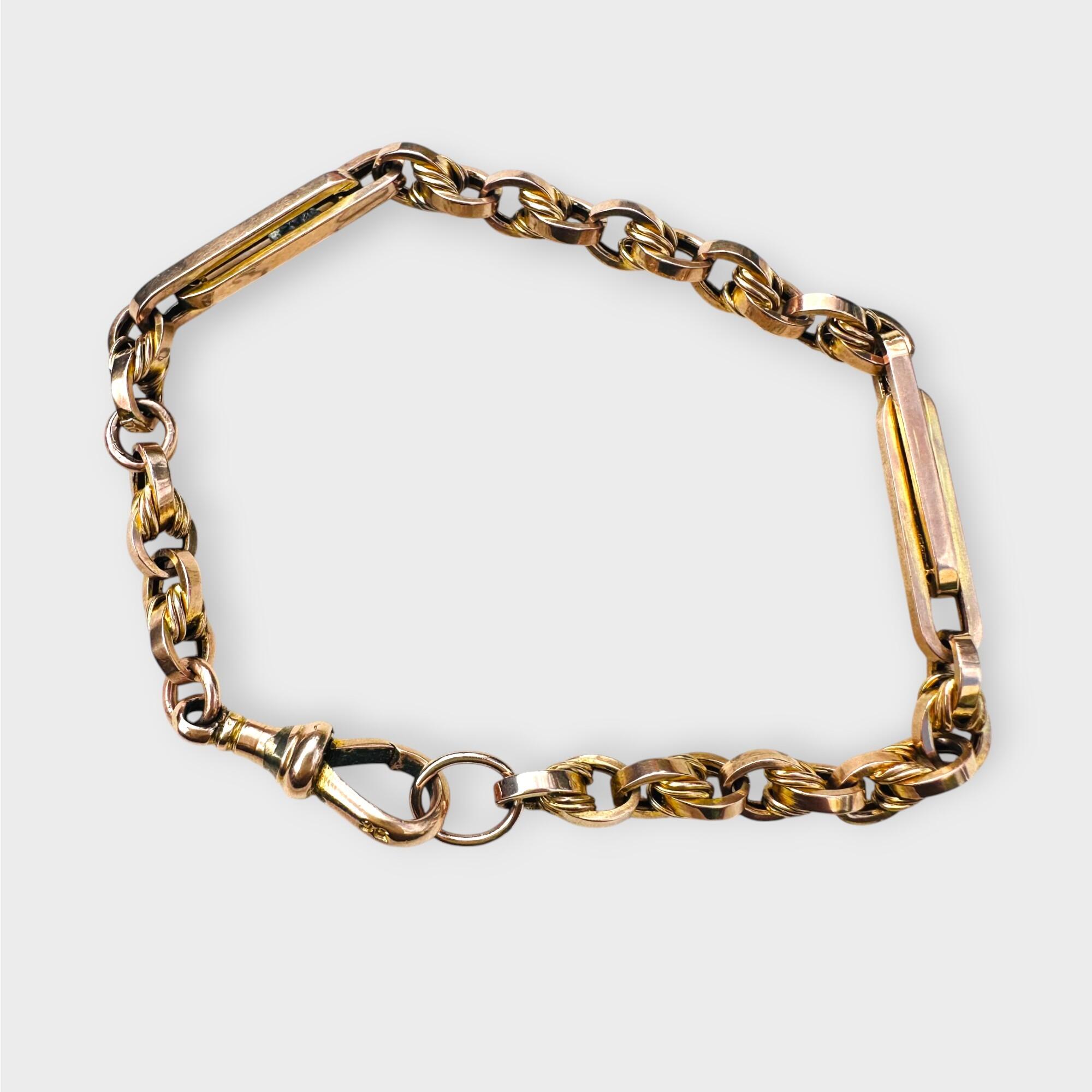 Antique 9k rose gold trombone and fancy link bracelet with dog clip clasp – 19.5 cm length, grey back ground.