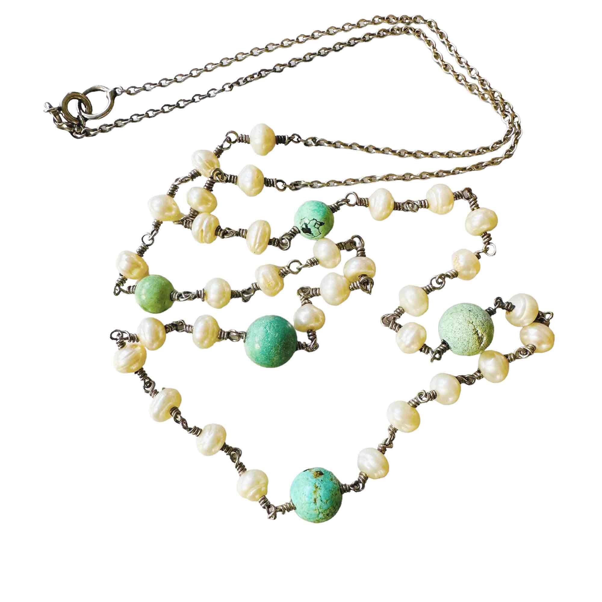 silver rolo link chain necklace with turquoise beads and pearls with white background