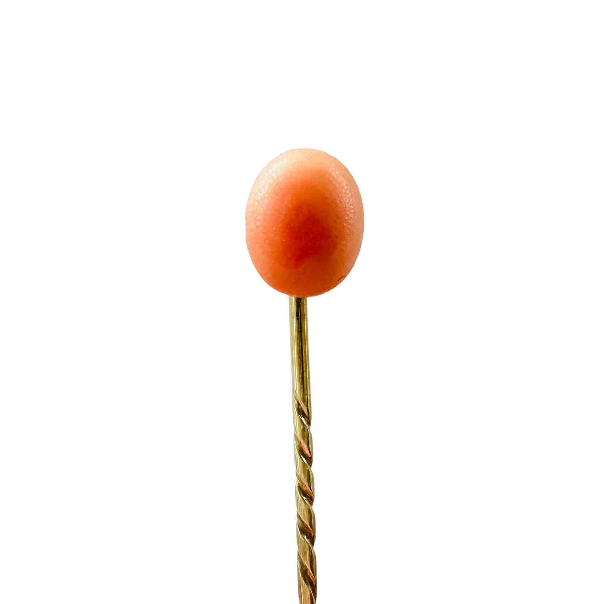 Victorian yellow gold stickpin with single coral cabochon