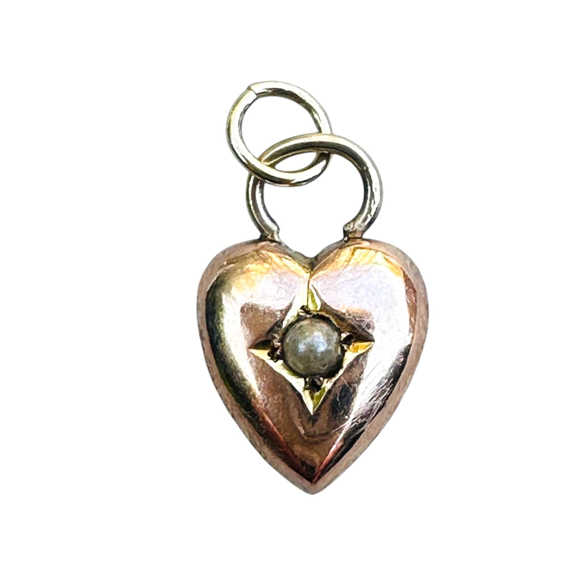 front view of Antique Tiny Victorian 9ct Gold Pearl Heart Charm with white background