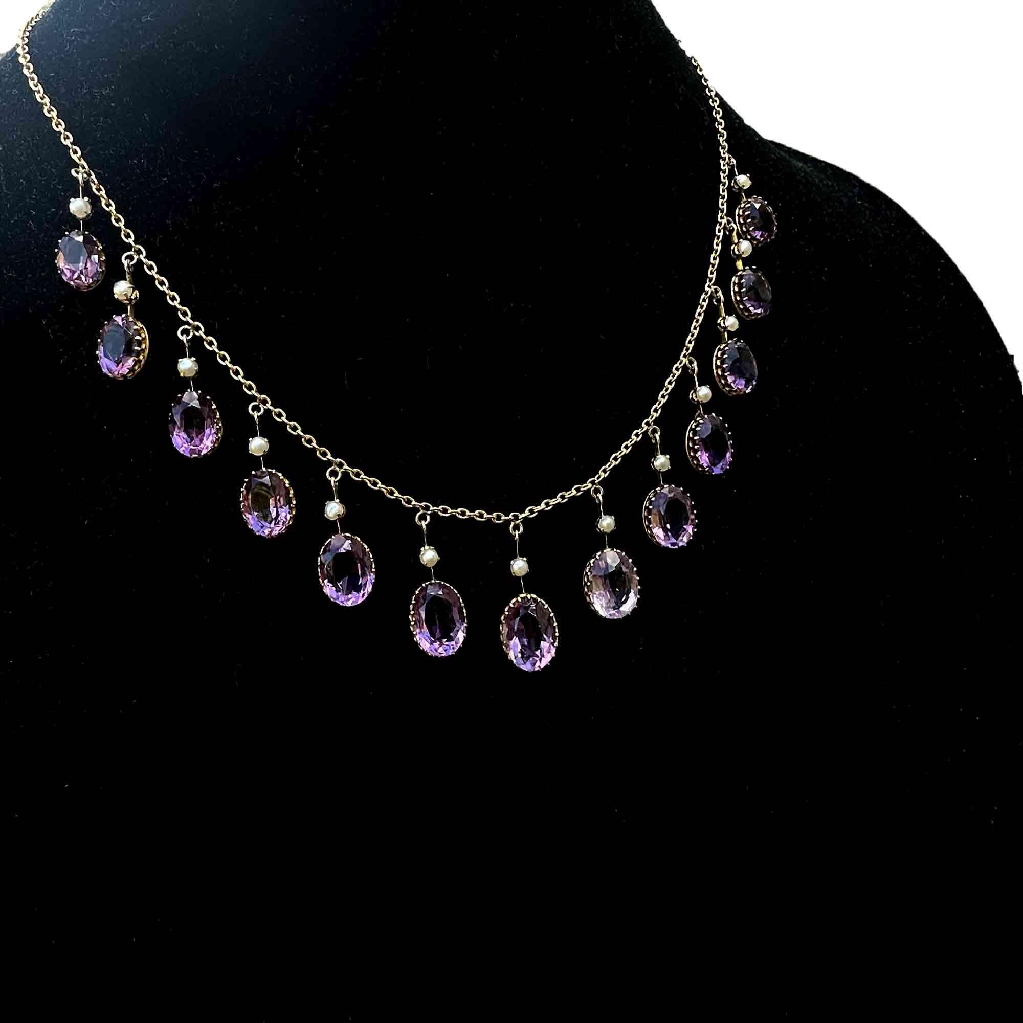 Victorian 9ct gold fringe necklace with amethyst and pearl drops on black velvet bust.