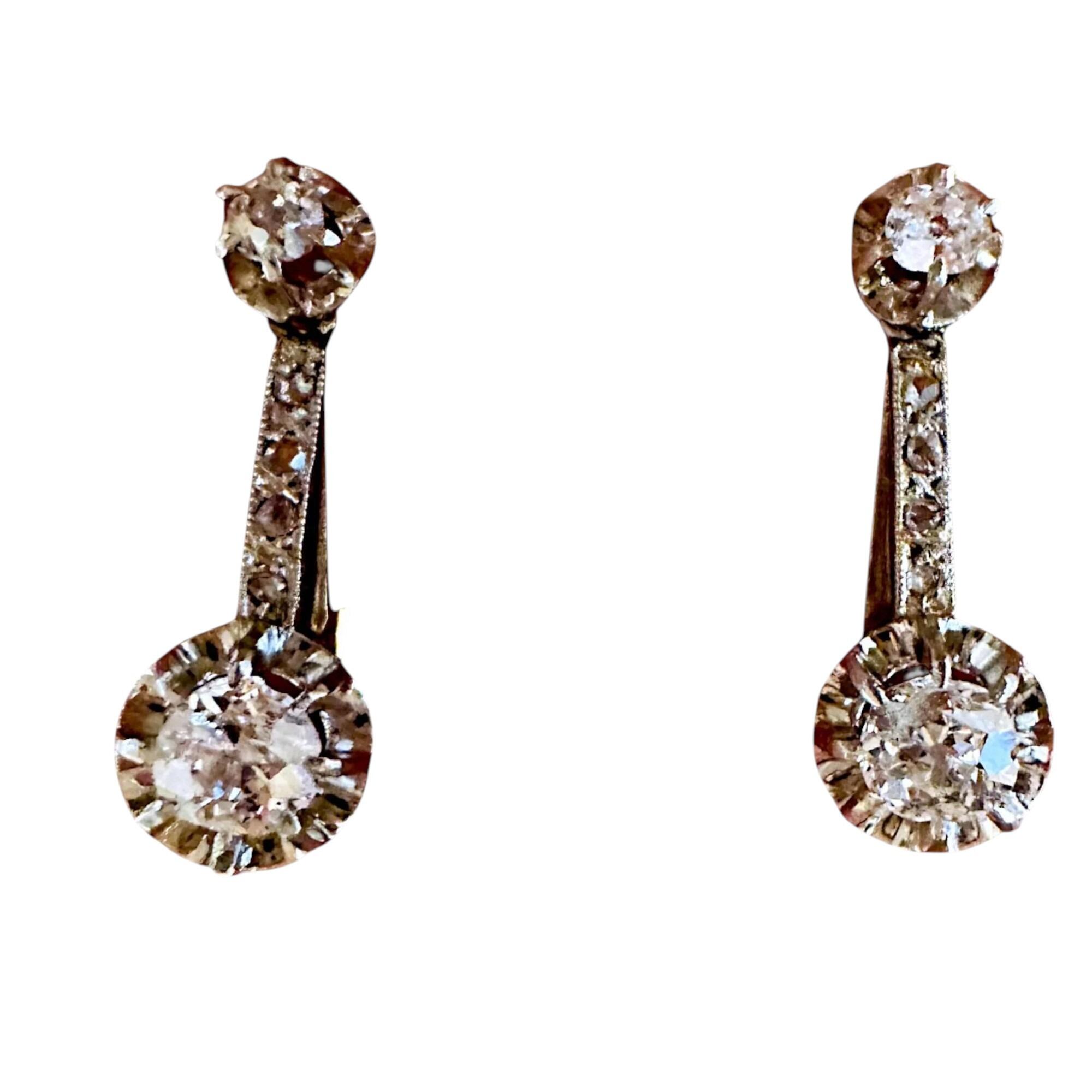 French Belle Époque Dormeuse Earrings in 18K Gold with 0.50ct Diamonds and Hallmarked with French Eagle with grey background.