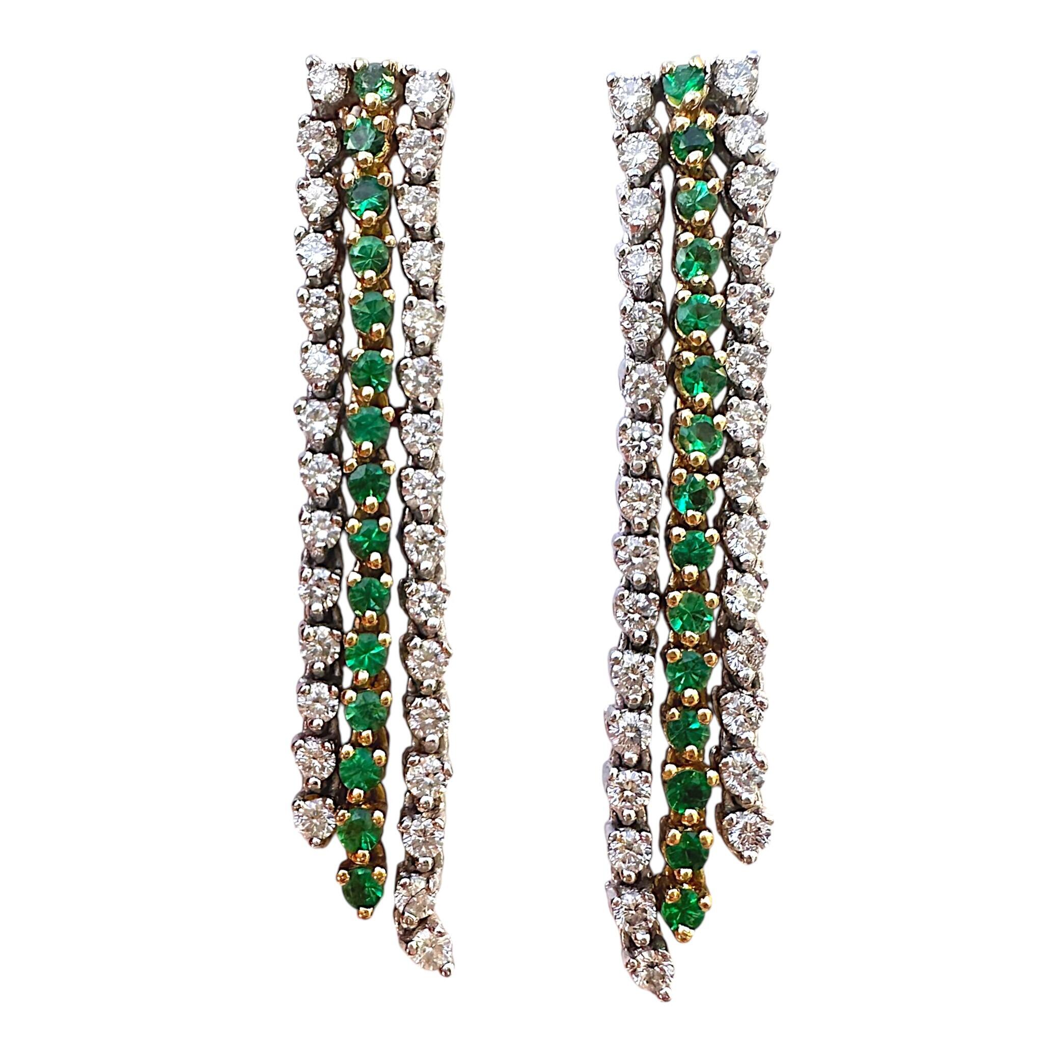 front view of 18K Gold, Emerald & Diamond Drop Tassel Earrings with white background