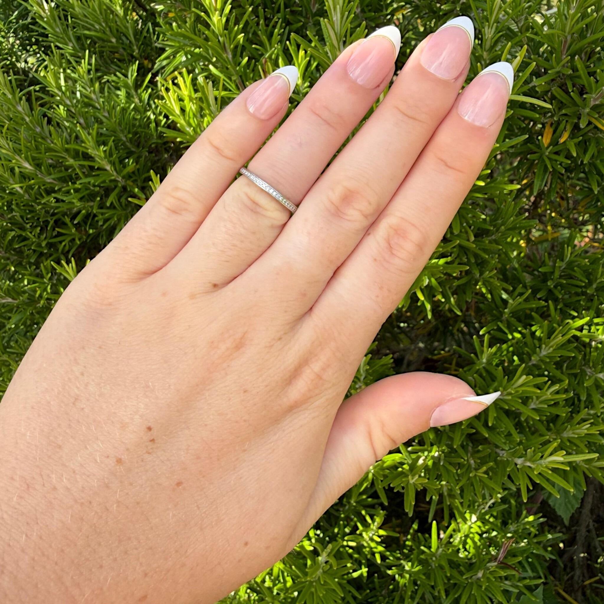 Vintage Platinum Diamond Eternity Ring, Wedding Band worn on models hand in garden