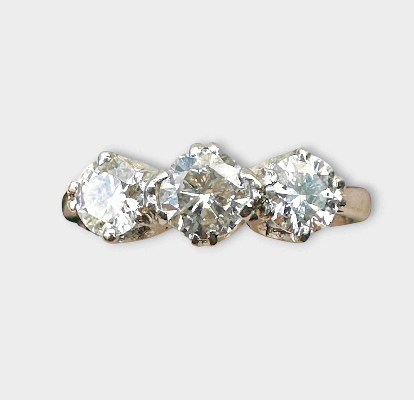 Mid-century platinum and brilliant cut diamond trilogy/three stone engagement ring