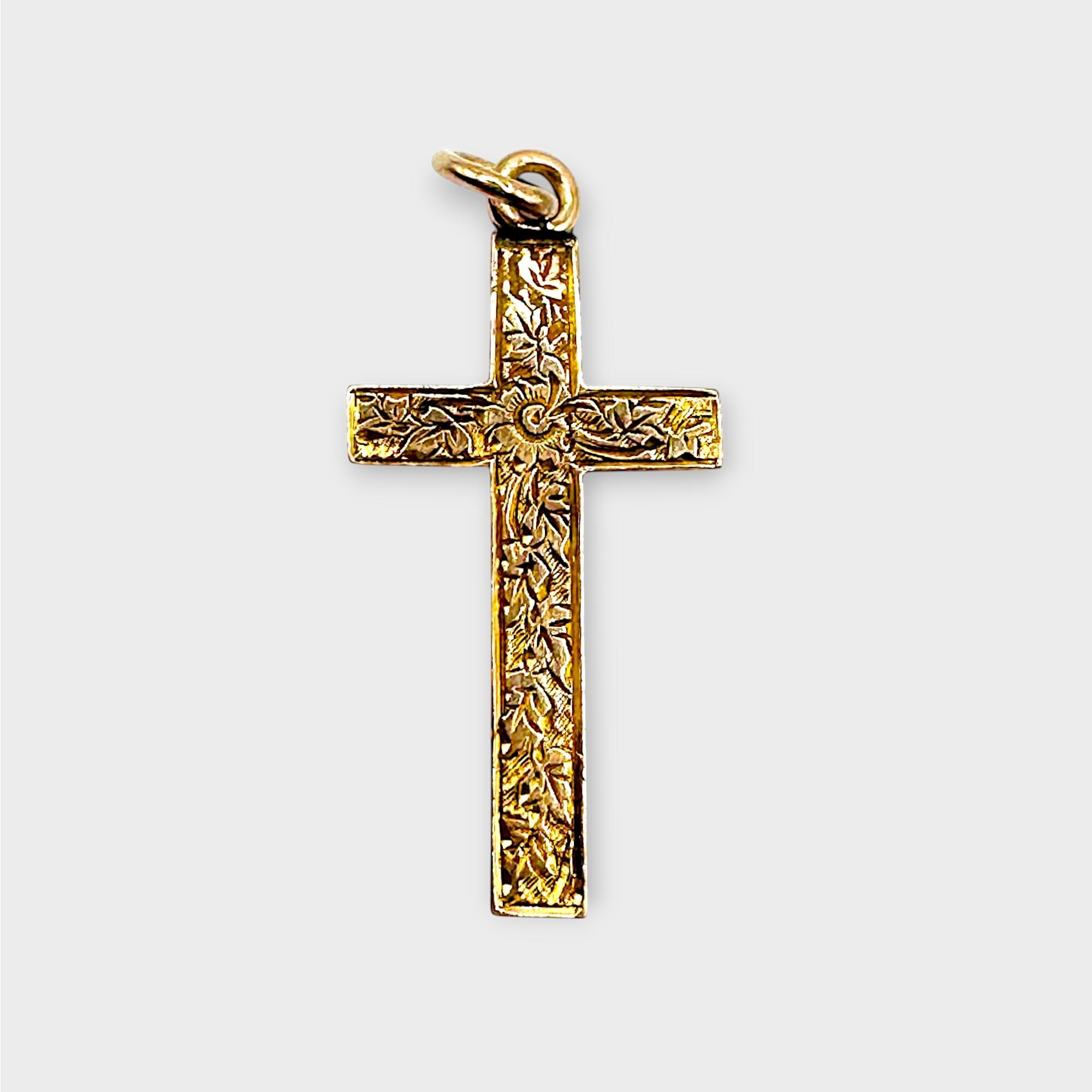 Victorian 9k rose gold engraved cross pendant on grey background