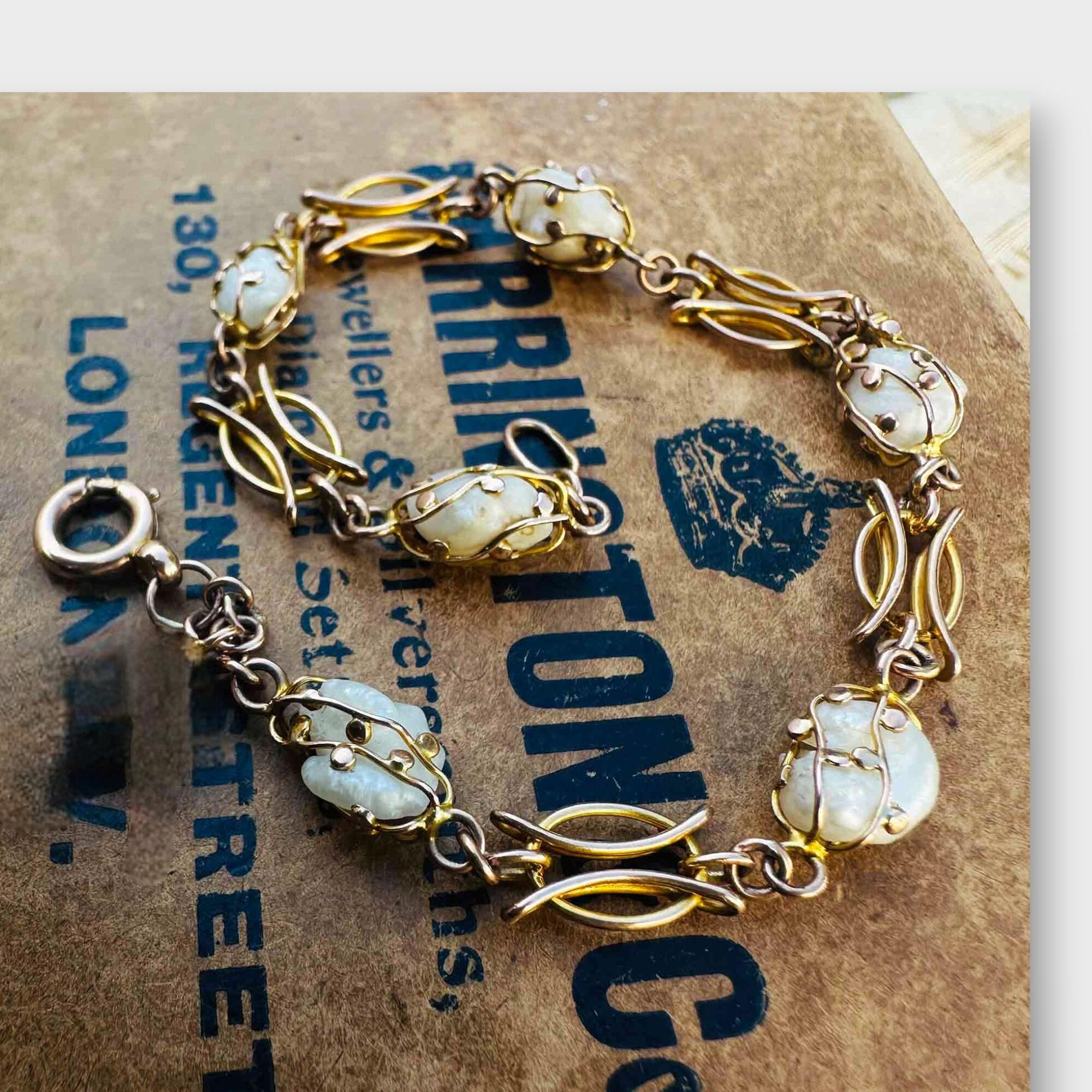mississipi pearl and 9k rose gold bracelet on antique box.
