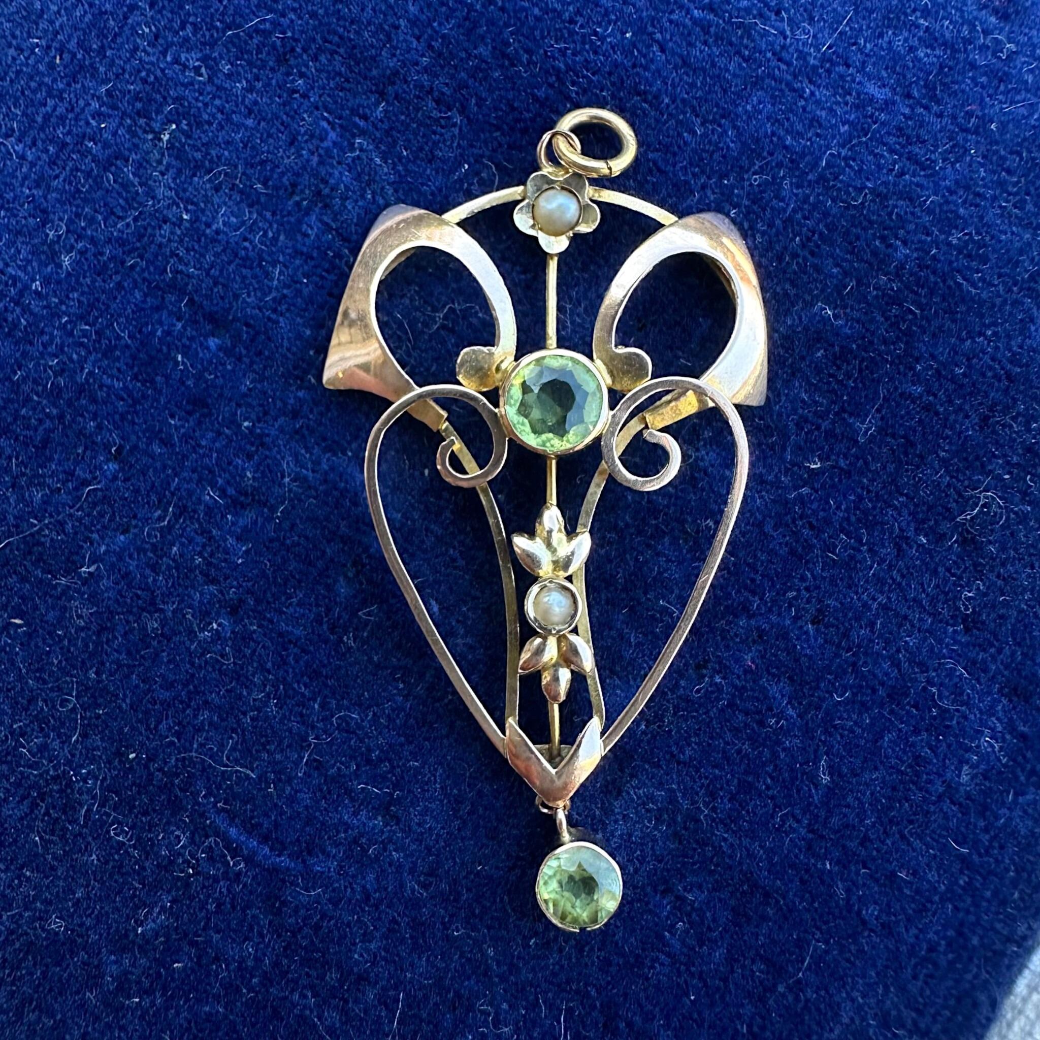Rose Gold Peridot & Pearl Heart Pendant displayed on blue velvet antique box