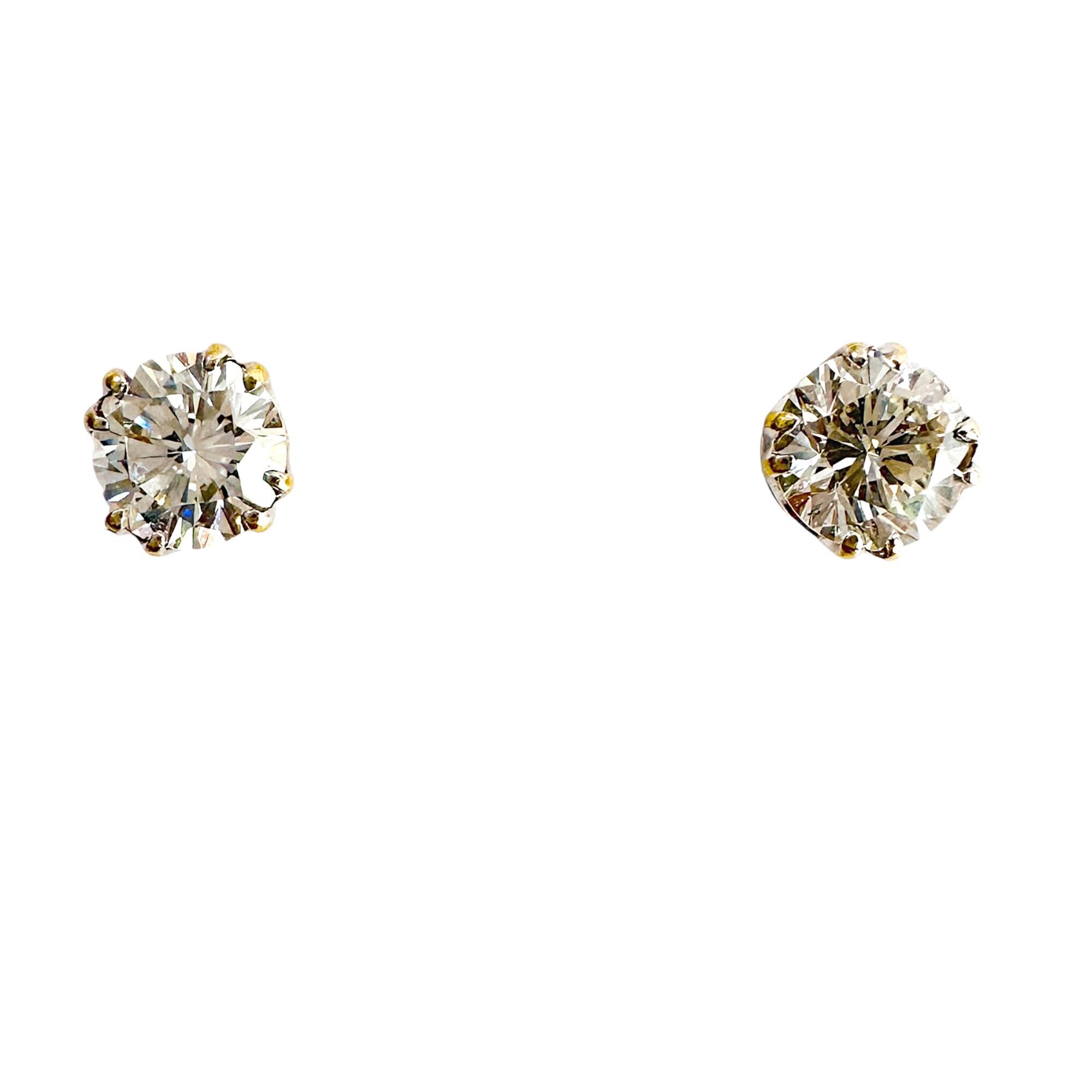 Large 4.7mm diamond stud earrings in 18ct white gold with platinum fittings with white background