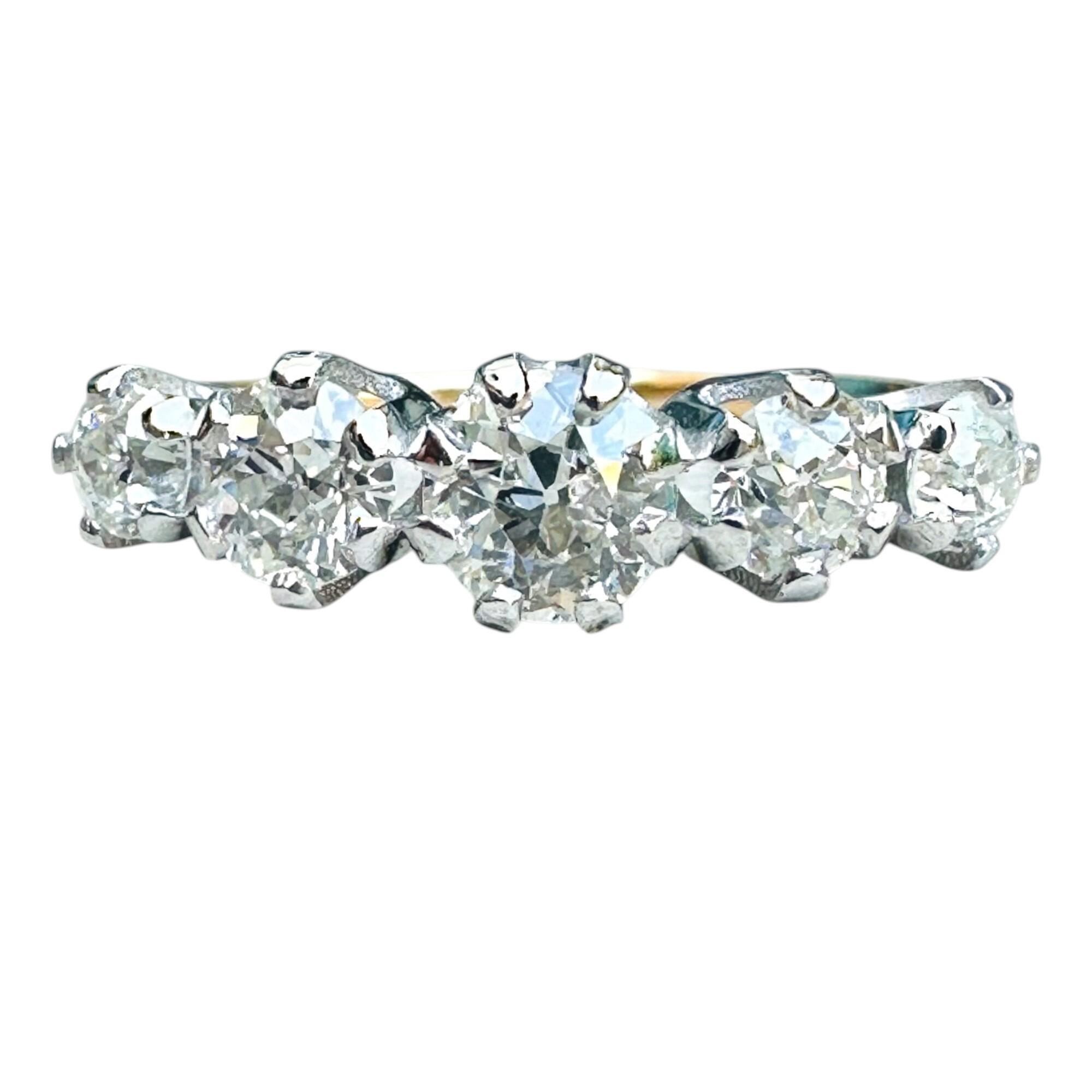 18k Gold Ring with 1.20ct Antique Old Cut Diamonds, white background.