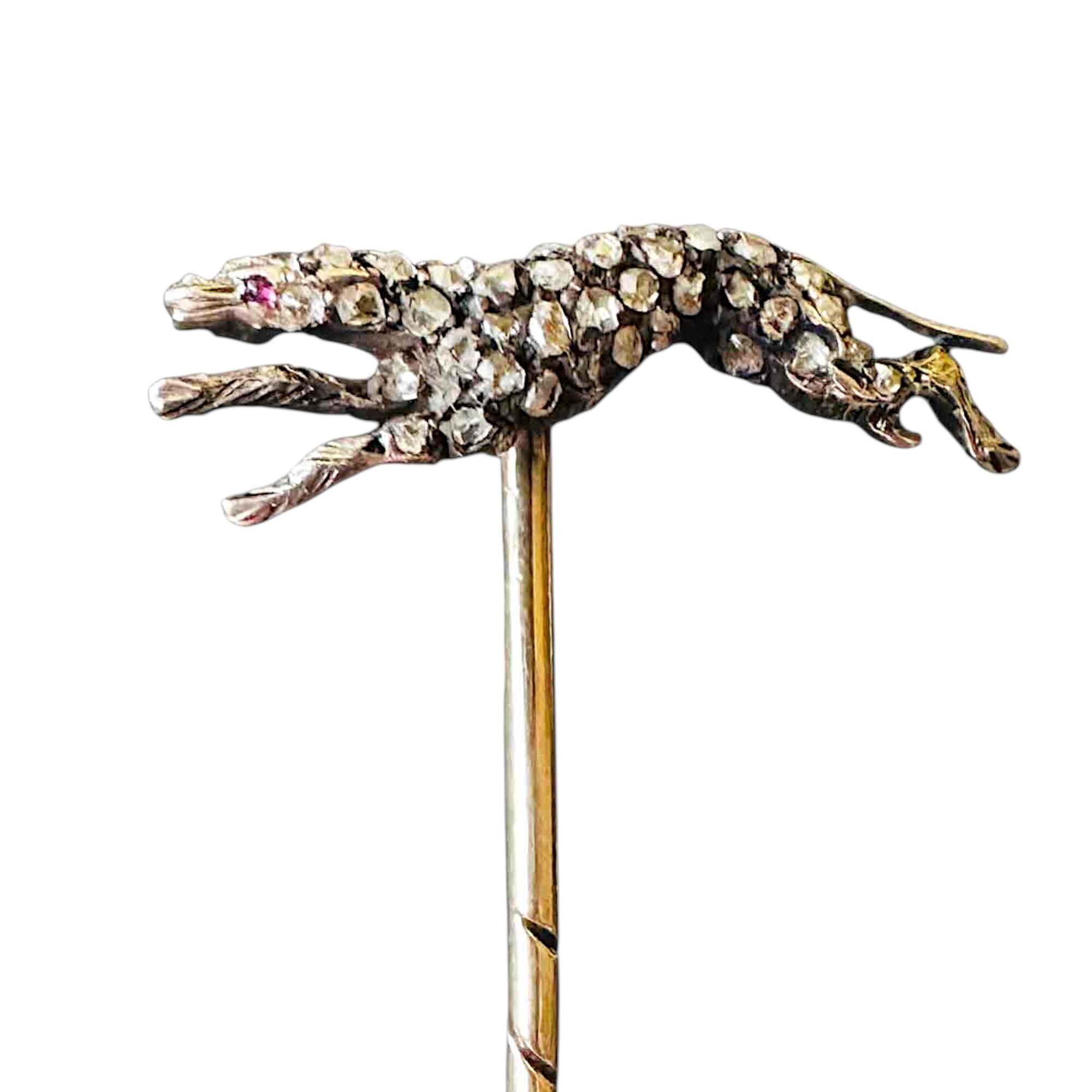 antique stickpin featuring diamond encrusted greyhound with ruby accent eye