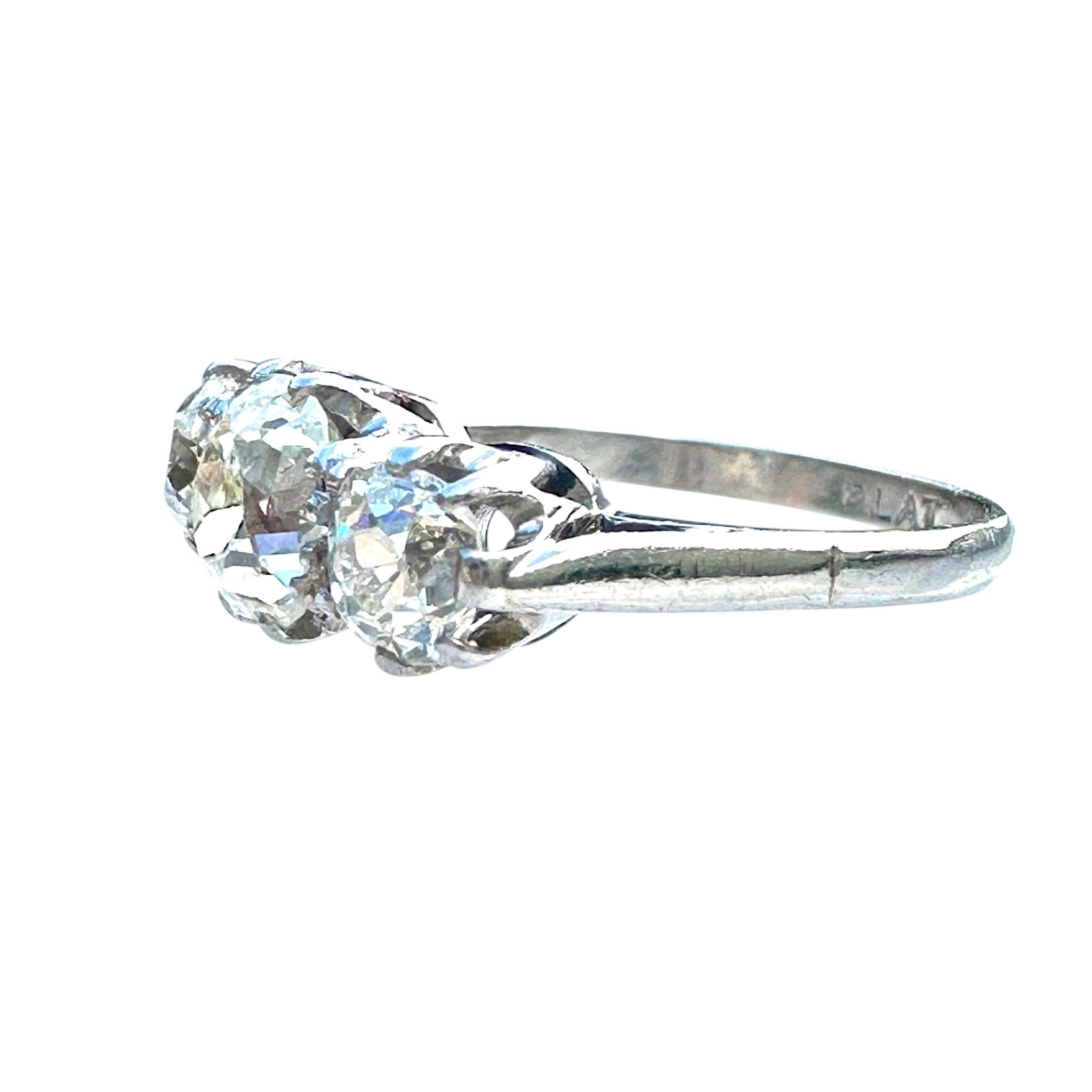 side view of Antique Platinum Old Cushion Cut Diamond Trilogy Ring  with white background