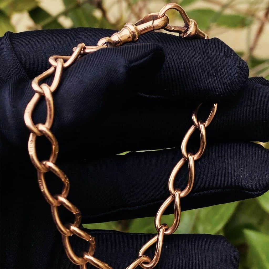 Antique 9ct rose gold graduated curb link bracelet with dog clips, 9 inches long, Edwardian era, very good condition