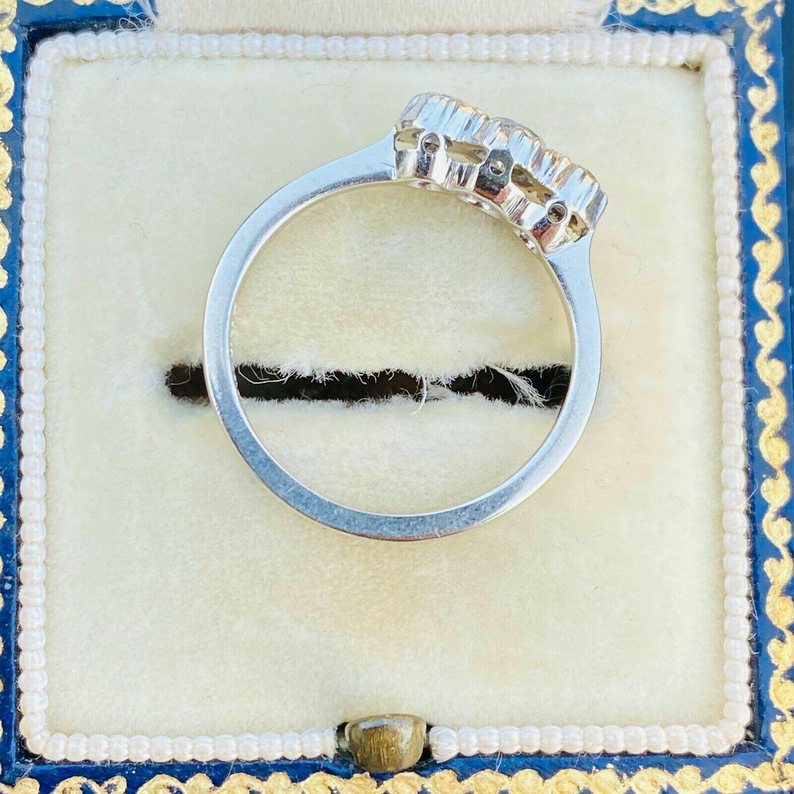 Elegant trilogy ring with 3.5mm central diamond, 2.5mm side diamonds, platinum and 18ct white gold, 0.30ct total weight