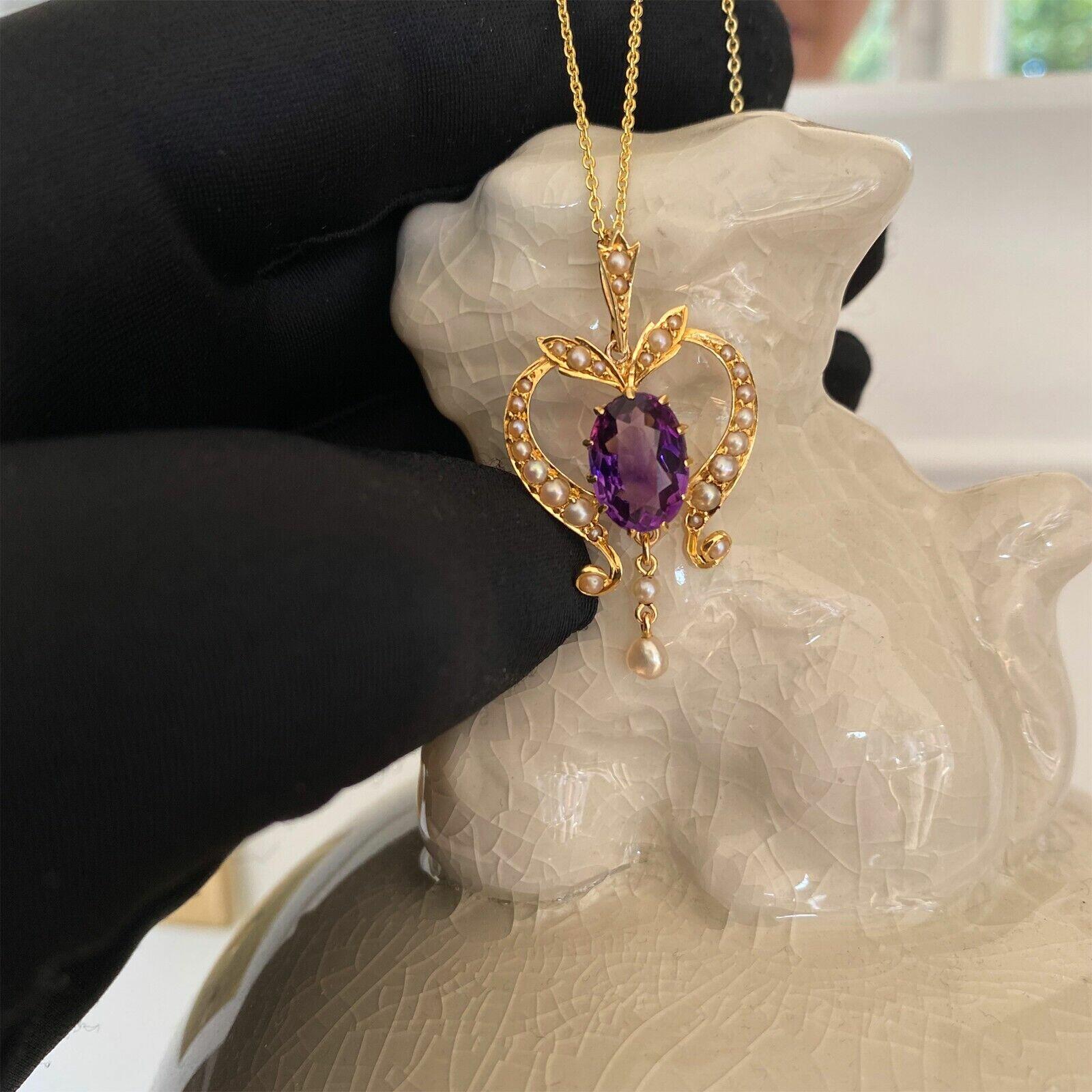 Edwardian pendant with deep purple amethyst in pearl mounted heart frame, Art Nouveau design with pearl studded scrolls and leaves.