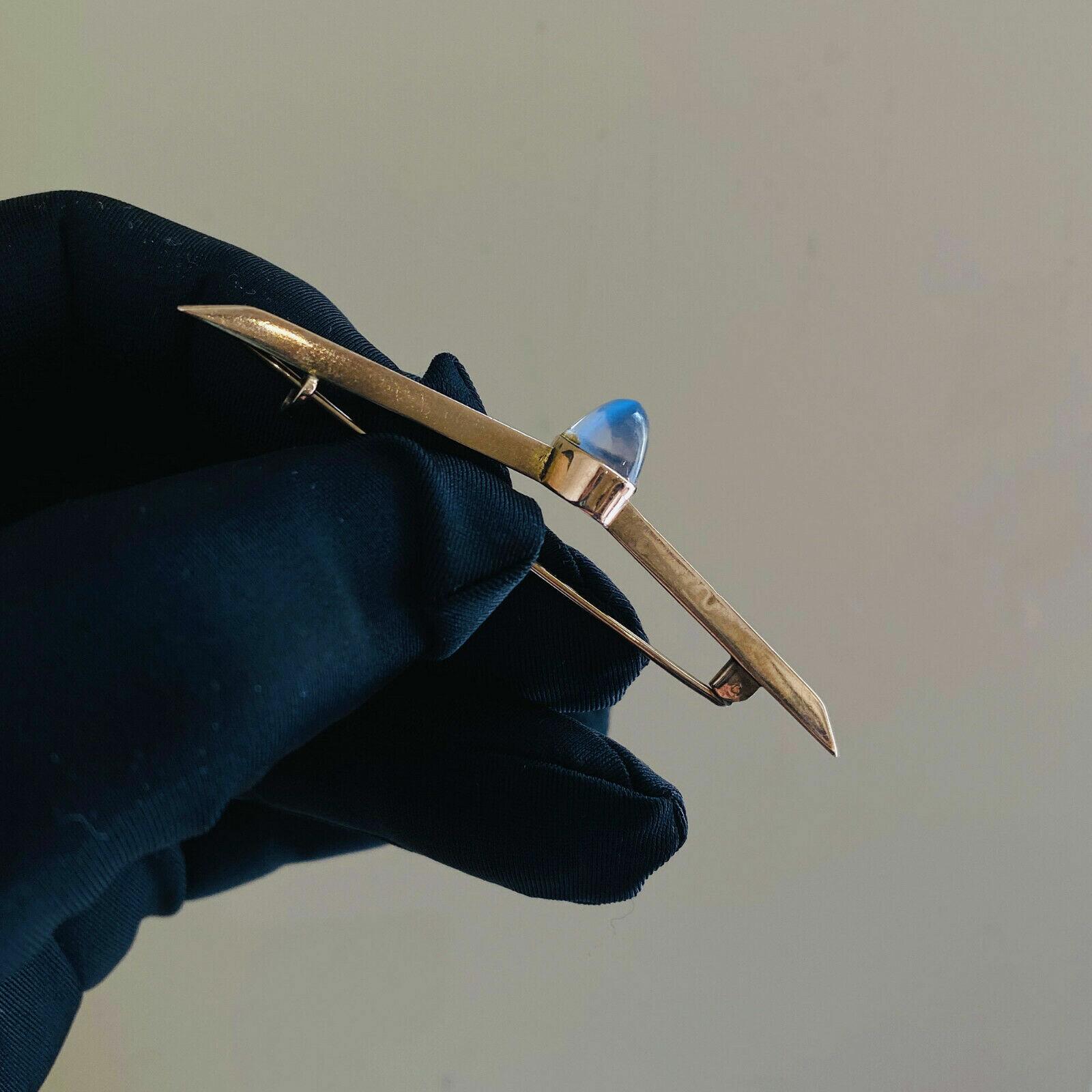 Victorian rose gold moonstone brooch with deep aduralescence and glacier mint-blue hues