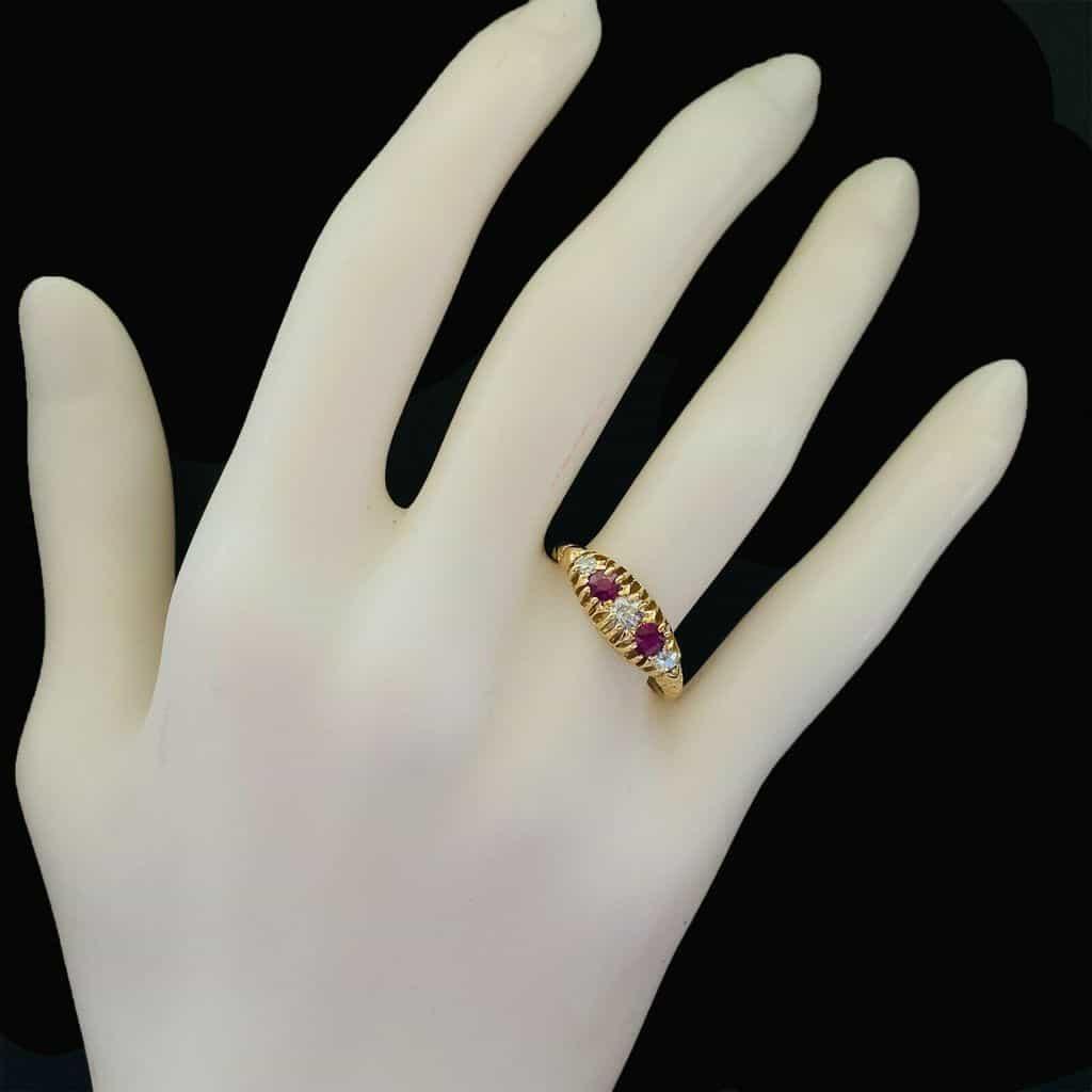 Edwardian 18ct gold ring with old-cut gemstones, including diamonds and rubies. Total gemstone carat weight of 0.45ct.