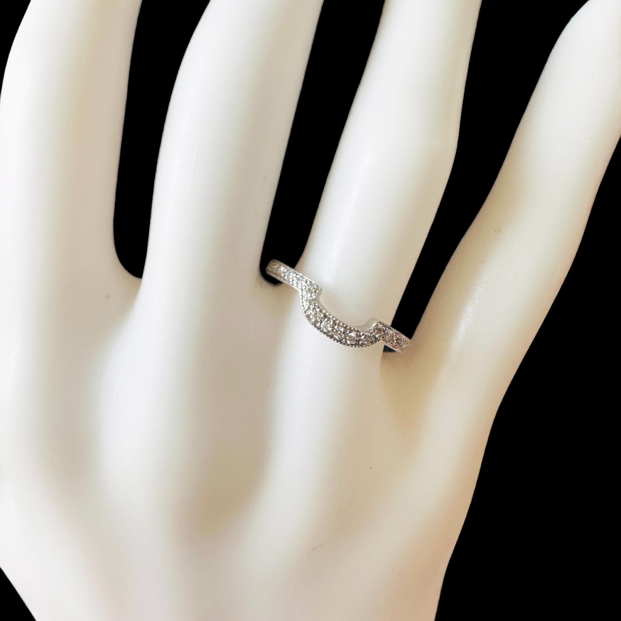 Elegant diamond ring with 20 brilliant-cut diamonds in a claw setting, perfect as a wedding or anniversary band.