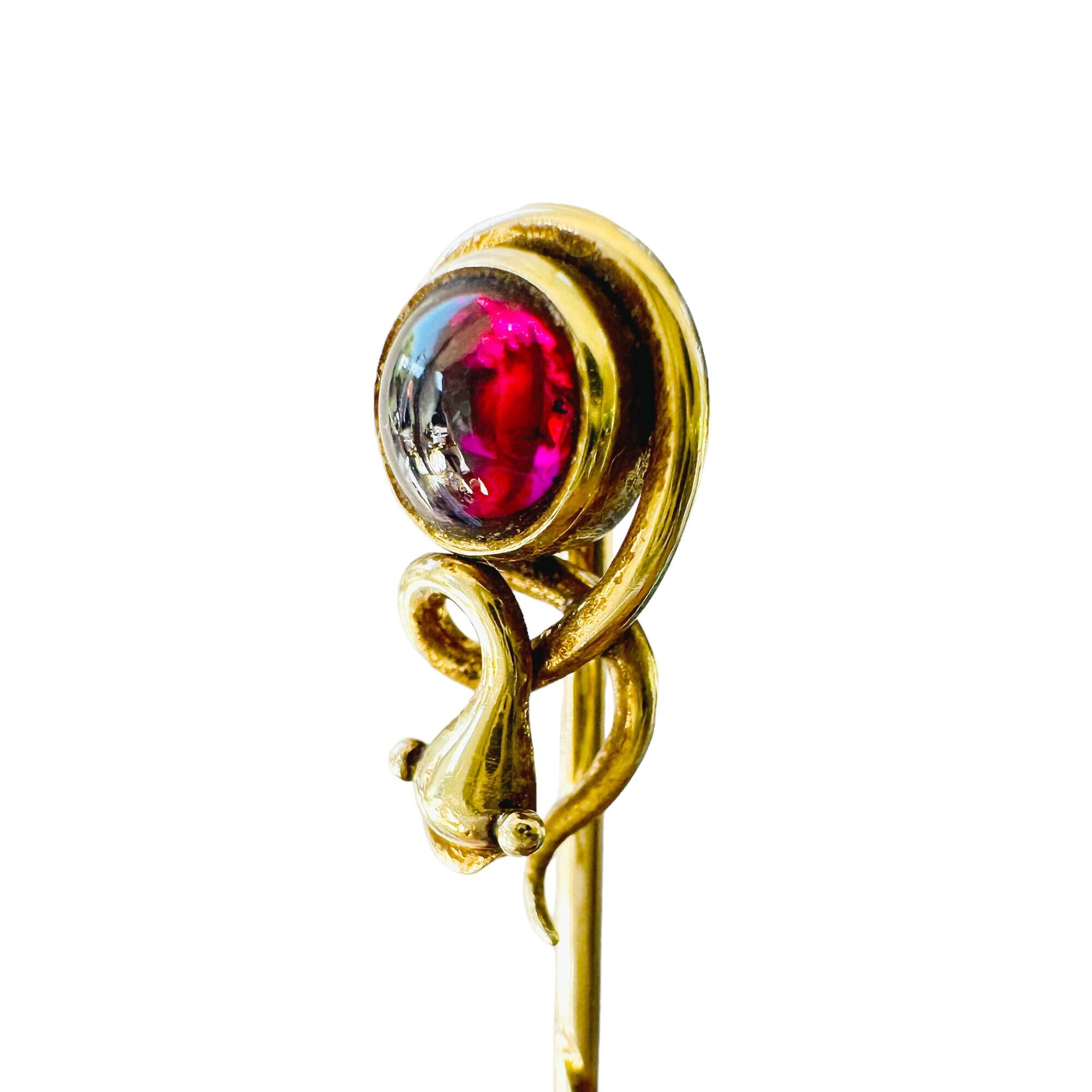 Victorian stick pin with 5mm cabochon rhodolite garnet, golden snake motif, 15ct gold, 8.2 x 15.8mm head, 54mm length.