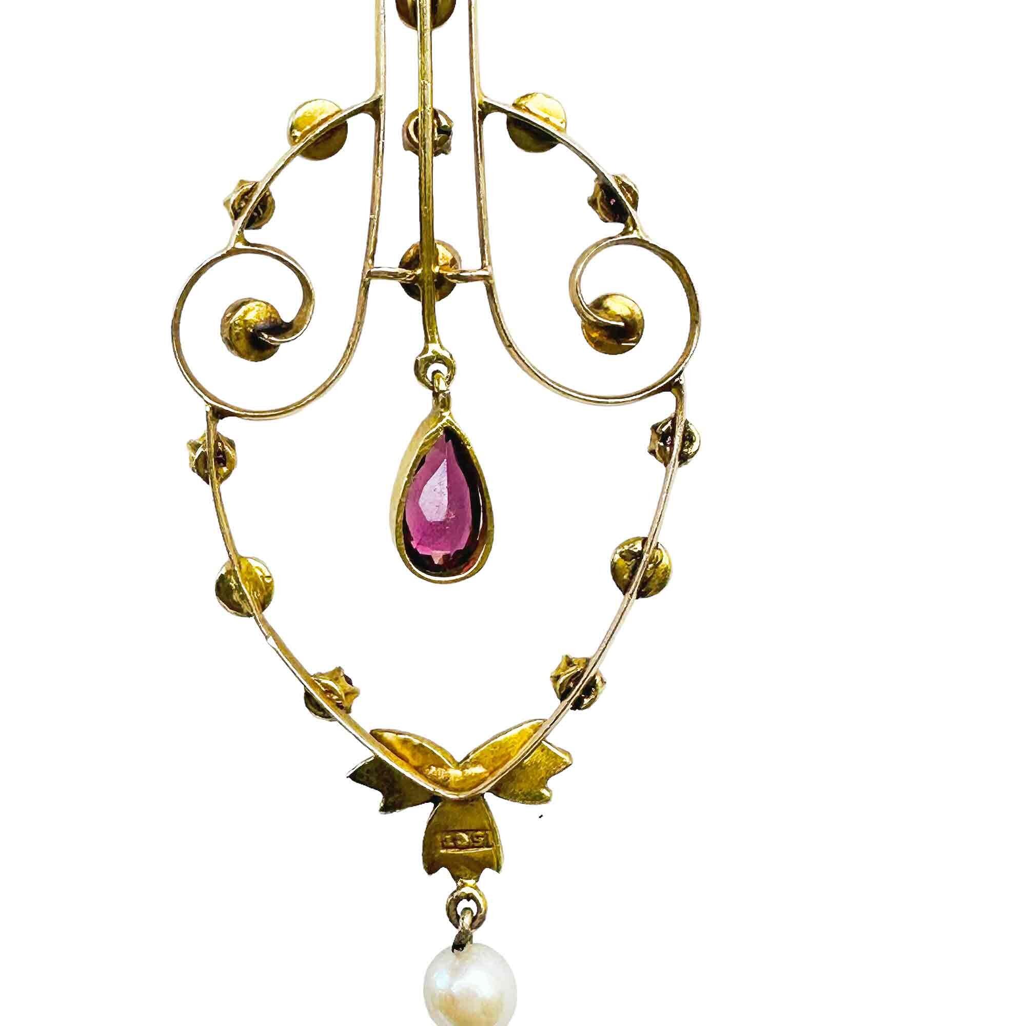 Edwardian era lavalier pendant with rubies, pearls, and garnet drop. Art Nouveau design, 15ct gold, 56.5x20.5mm.