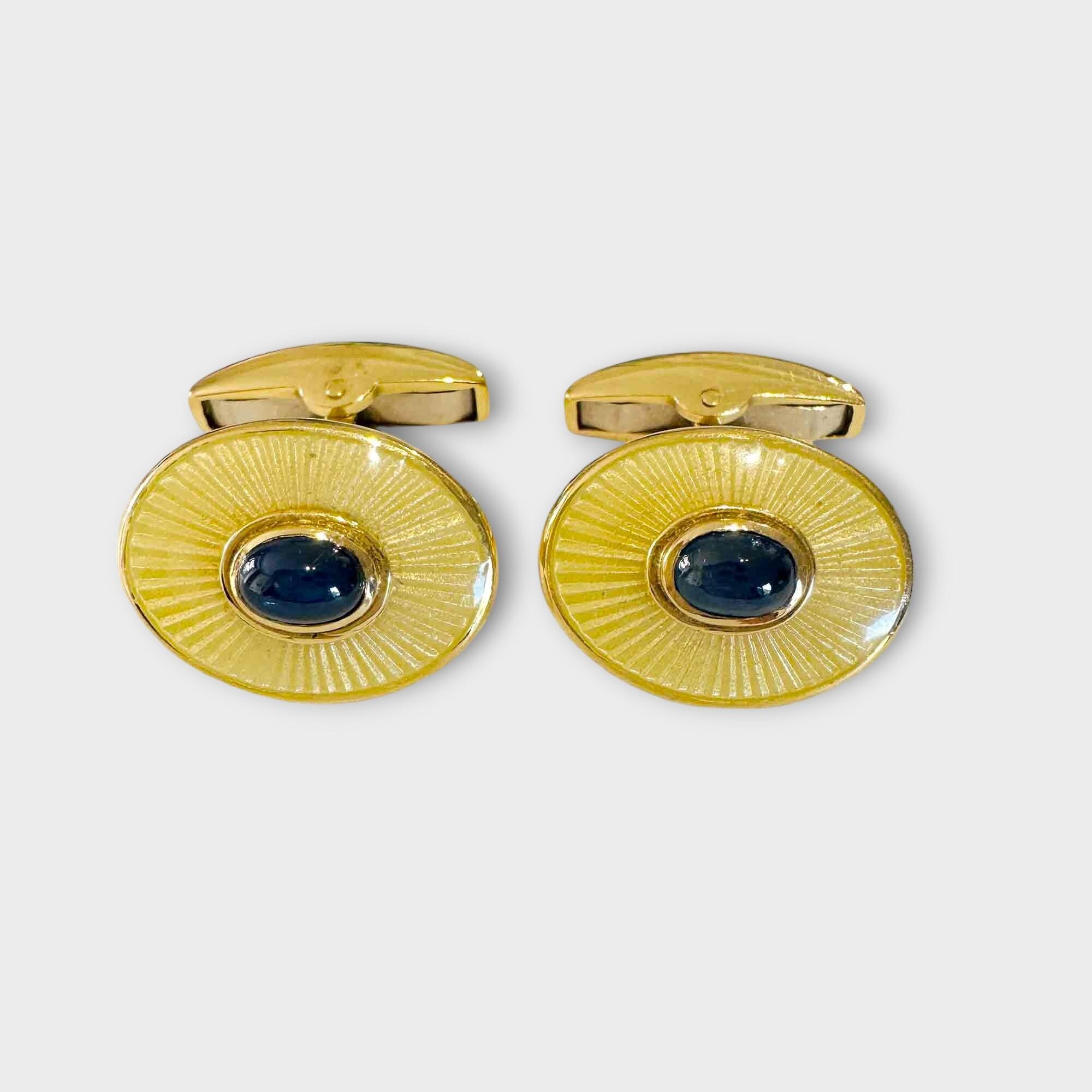 pair of oval yellow gold sunburst cufflinks with central cabochon sapphires