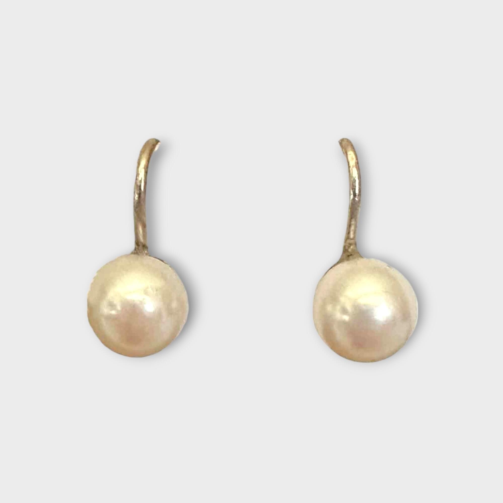 Elegant cultured saltwater pearl earrings in 9ct white gold with screw fittings, perfect for June birthdays and versatile wear.