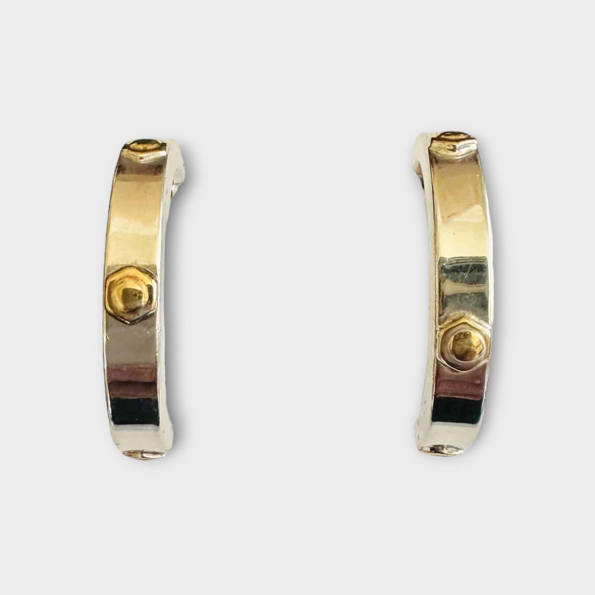 white gold hoop earrings with yellow gold bolt head decoration