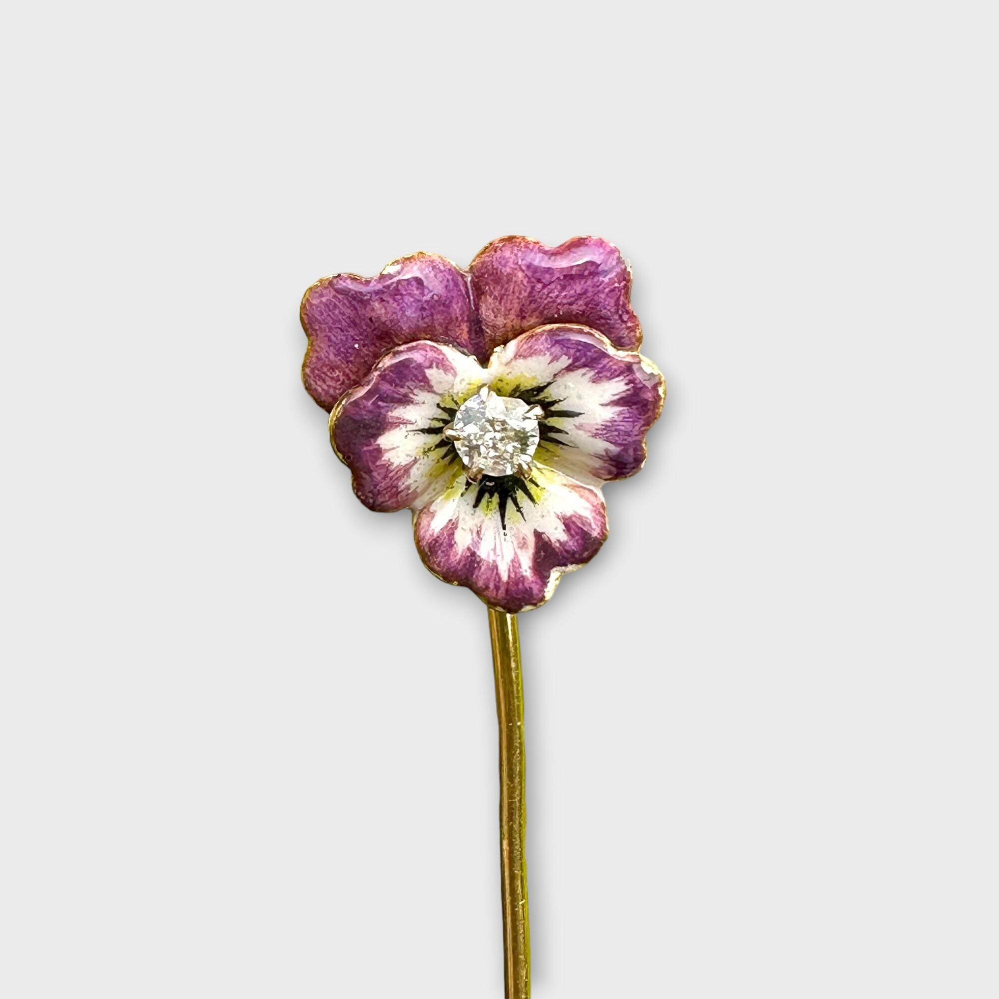 Antique Victorian stickpin with enamel pansy flower, old-cut diamond center, and 14ct gold pin, detailed in purple, lilac, and white.