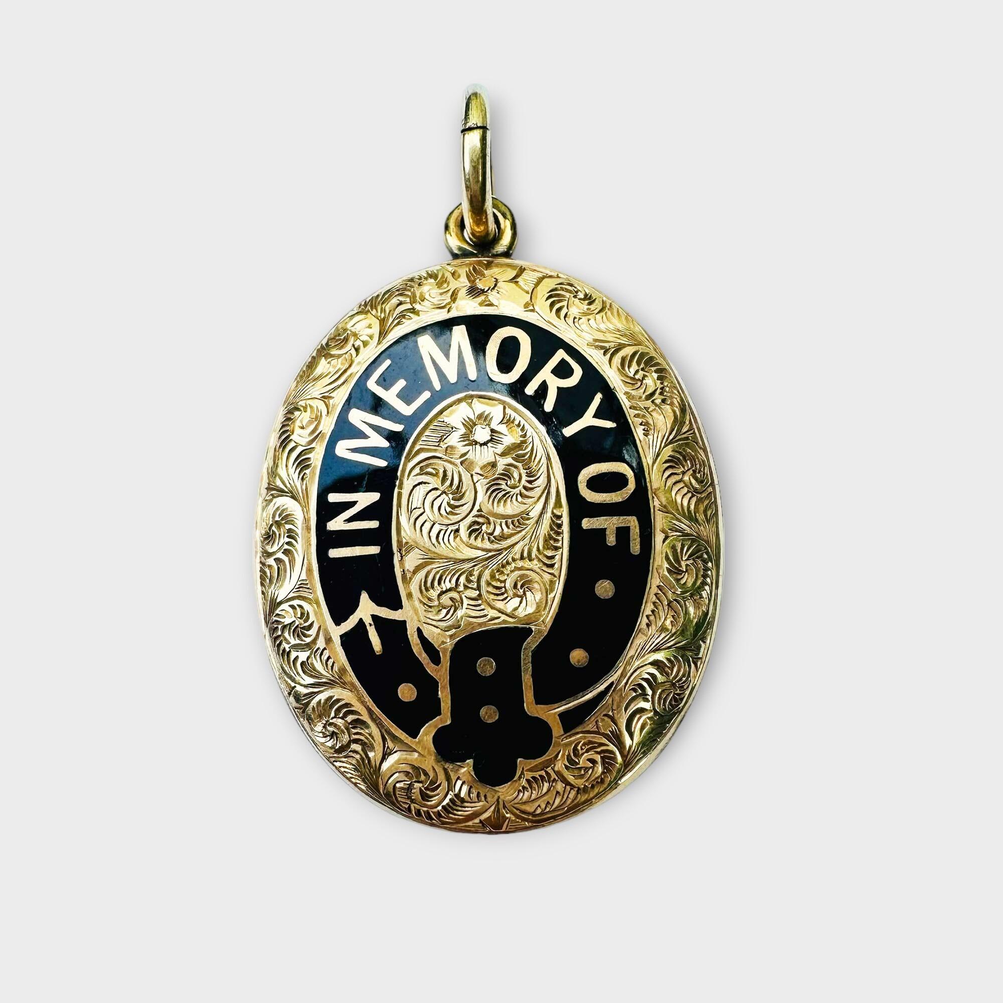 Antique Victorian oval locket with hand engraved foliate design, black enamel belt 'IN MEMORY OF', and glaced locket with plaited hair