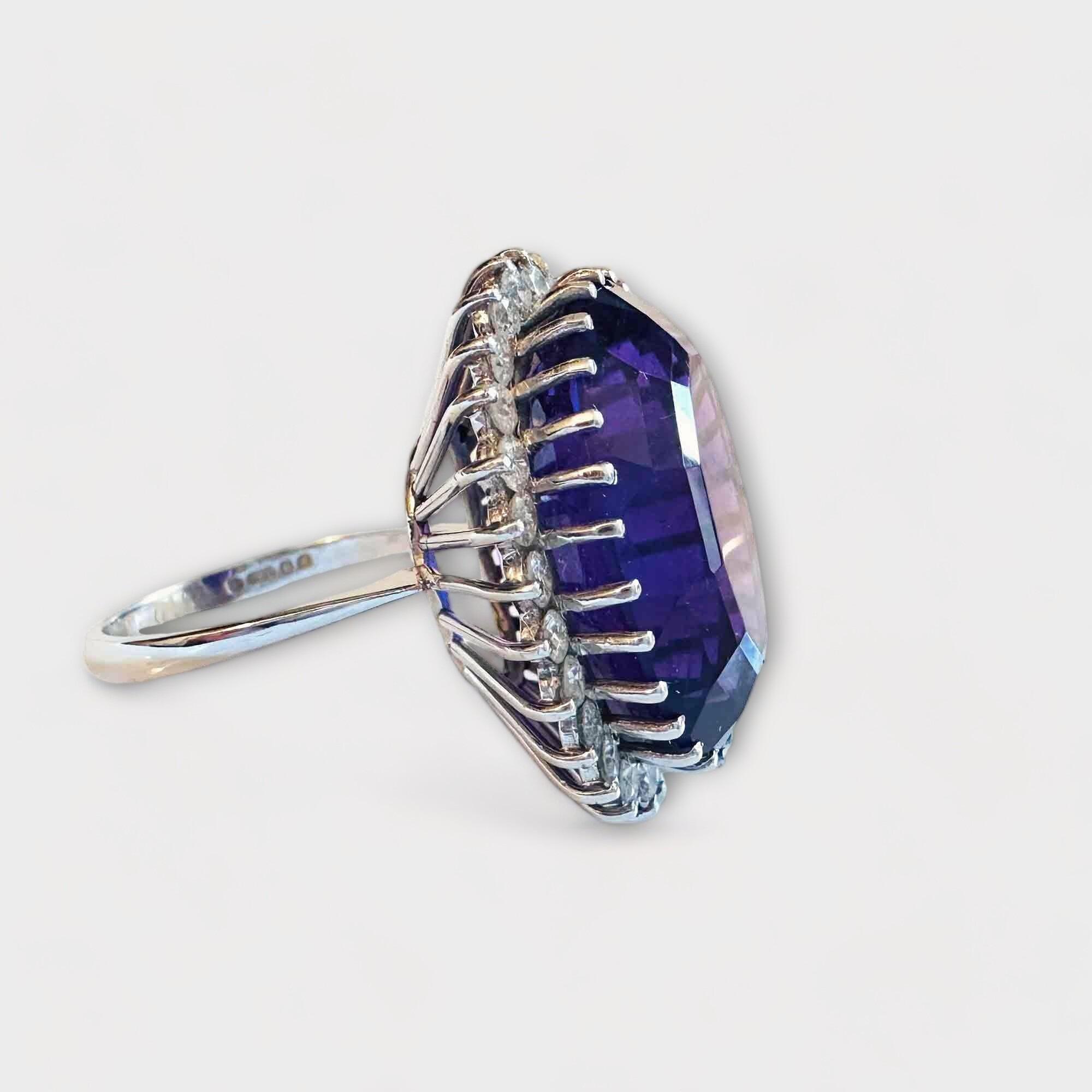 Stunning 18ct white gold flower cluster ring with a 23x1.5mm amethyst and 28 brilliant-cut diamonds, perfect for February birthdays.
