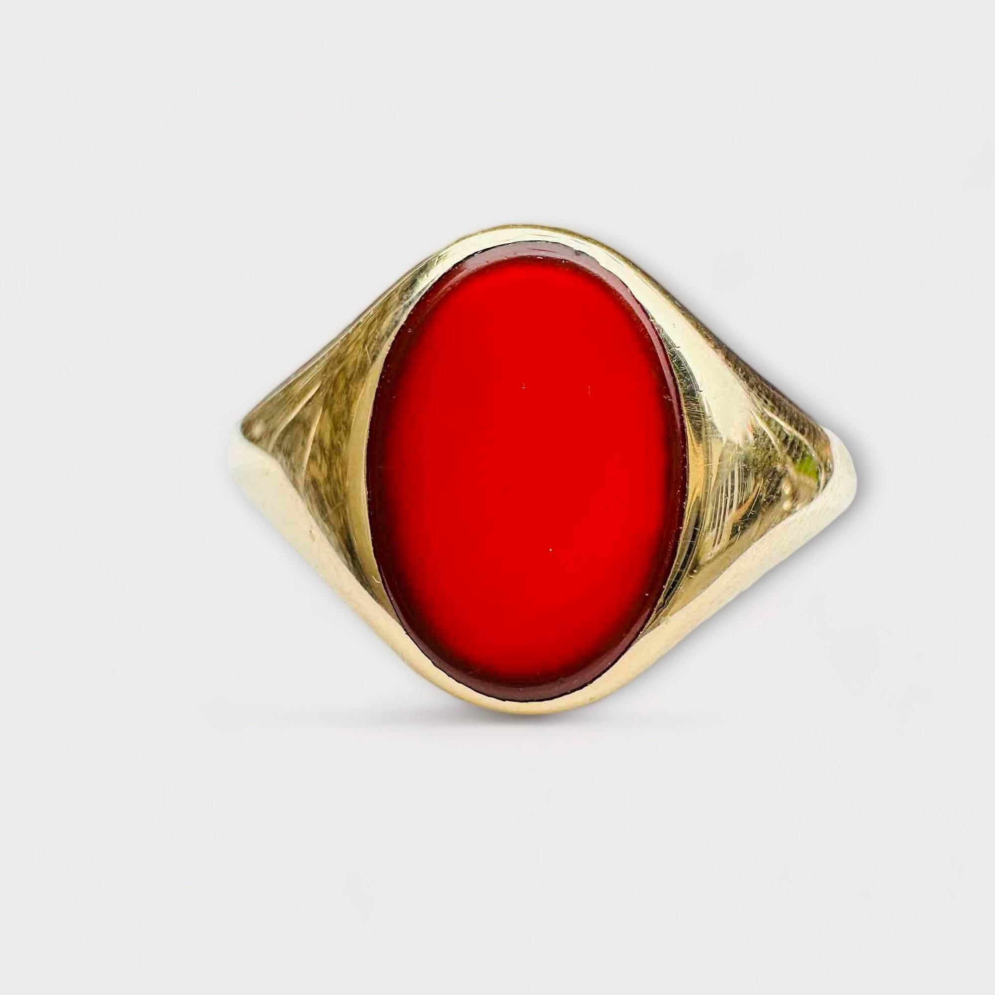 large oval carnelian signet ring with tapering yellow gold shoulders